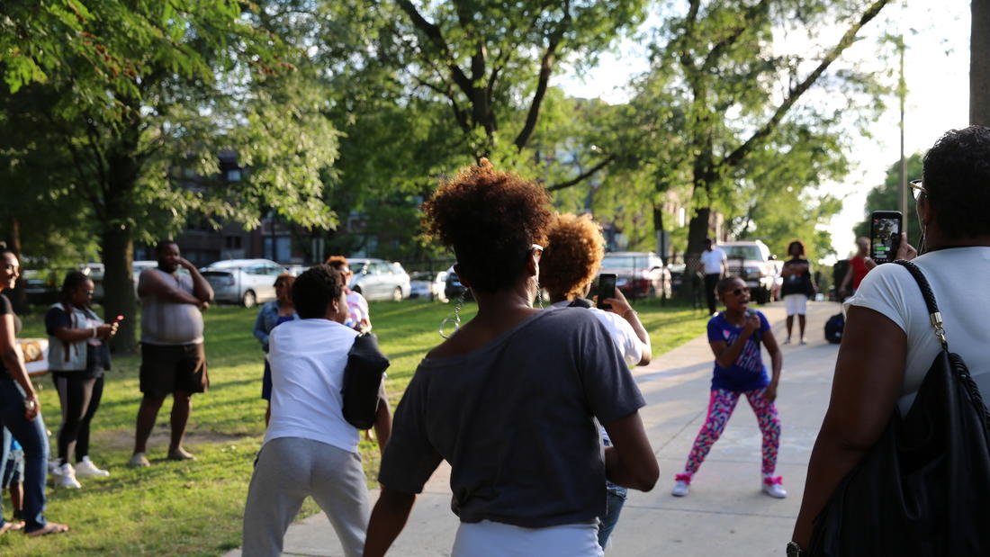 The audience at GLMPI’s Sankofa Nights, happening alongside P+NAP’s Community Celebration, dance along to Ms. Nina’s beats.