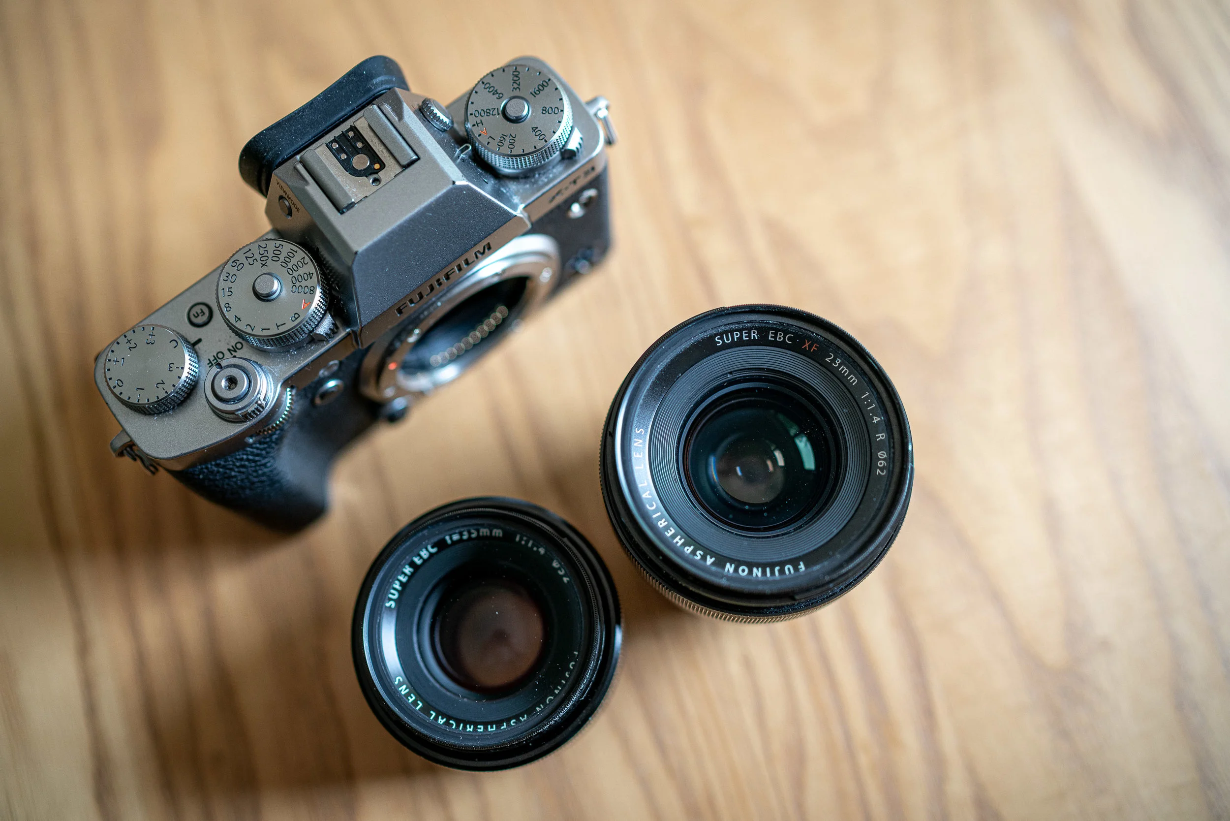 The Fujifilm XF23 and 35 F1.4. Also, note all those lovely dials on the X-T3.