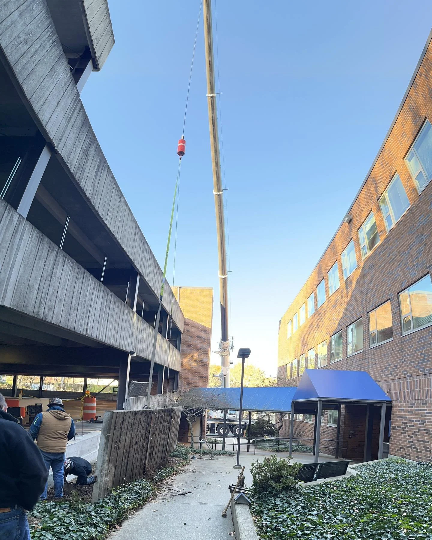 Happy Veteran&rsquo;s Day! The crew re-installed a concrete spandrel panel today dislodged by a vehicle. Thanks for the lift @h.a.leocrane #welder #ironworker #crane #wellesley #olearywelding
