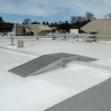 Another design, fabricate and deliver job being installed by the commercial roofing contractor. The end user needed a way to get their heavy carts over roof obstacles and approved our heavy duty serrated aluminum grating design.