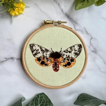 Nest Mini embroidery Tiger Moth 1.jpg