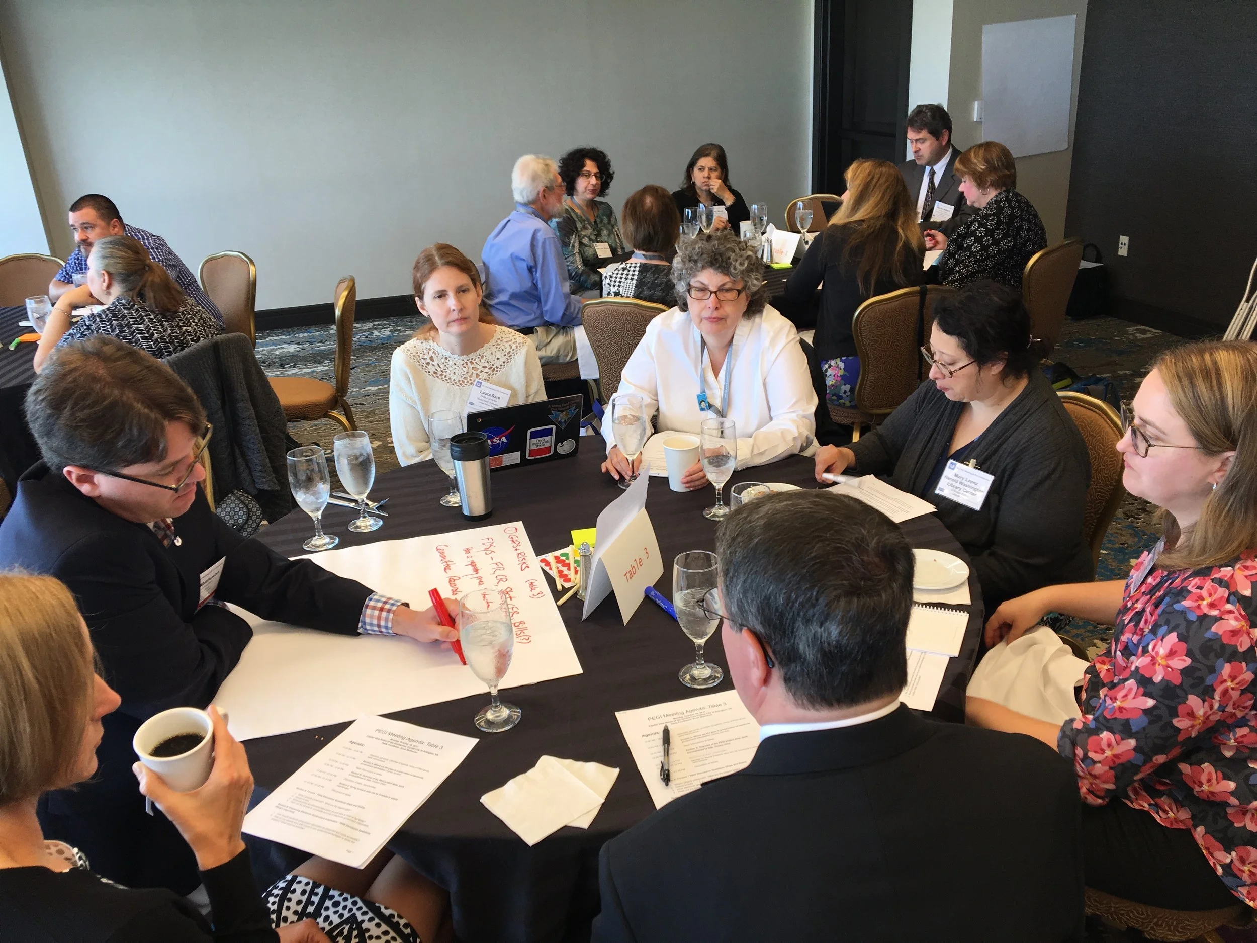 The group at table 3 identifying issues with preservation of electronic government information.