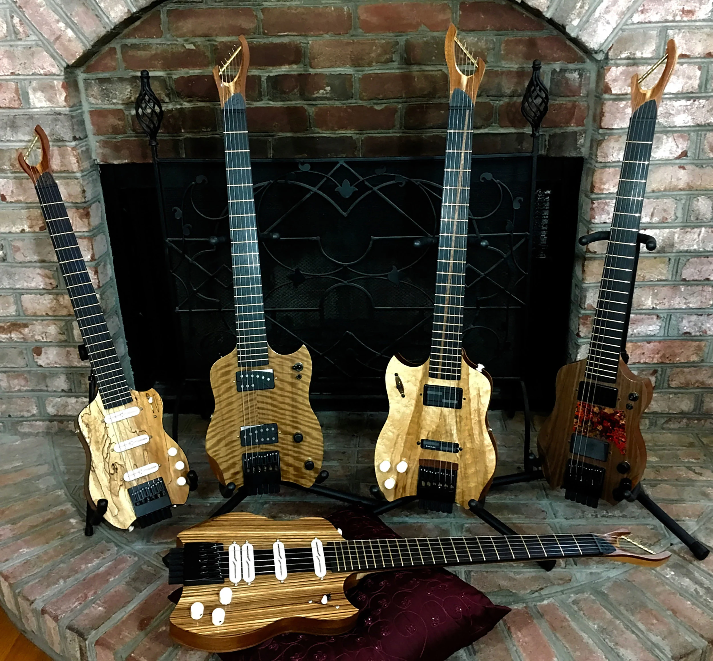 CharlestonGuitars_by_fireplace.jpg