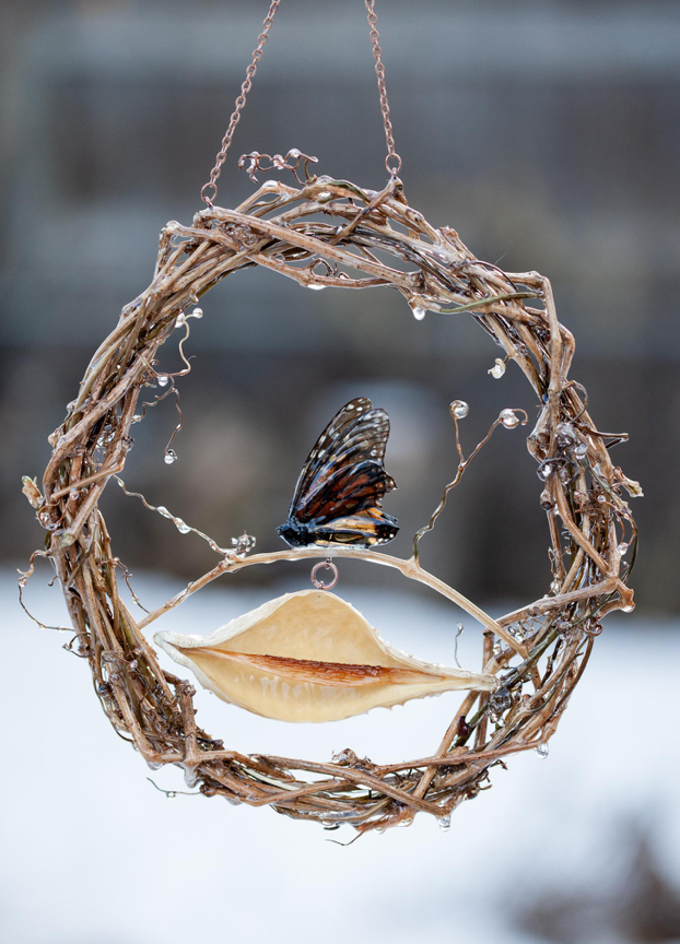 Wrapped vine window hang with Monarch and Milkweed seed pod, a The Wiley Rose personal favorite.