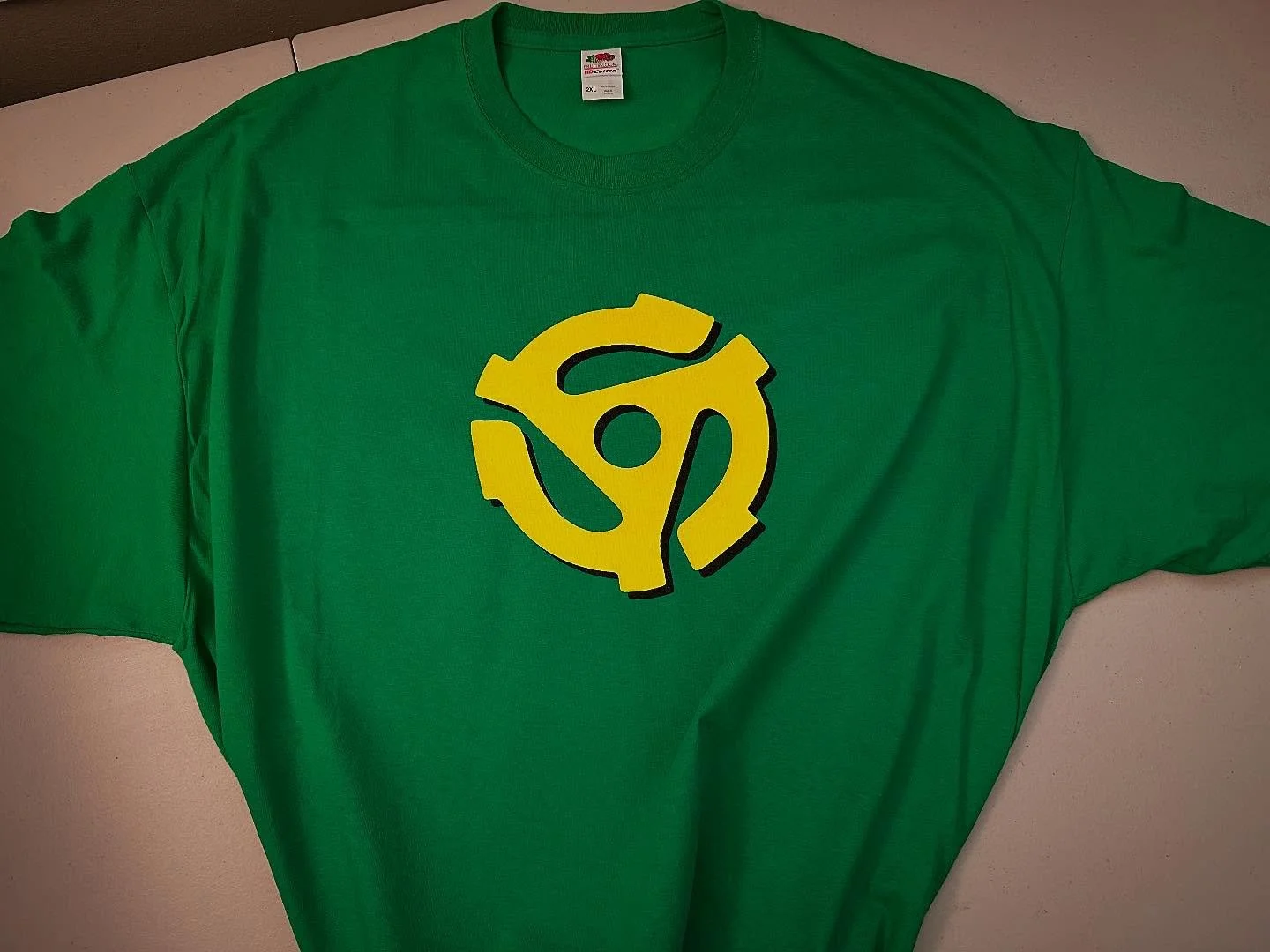 45 Adapter Spider 
Green Tee 
.
https://goaheadmerch.com/music/spider-45-adapter