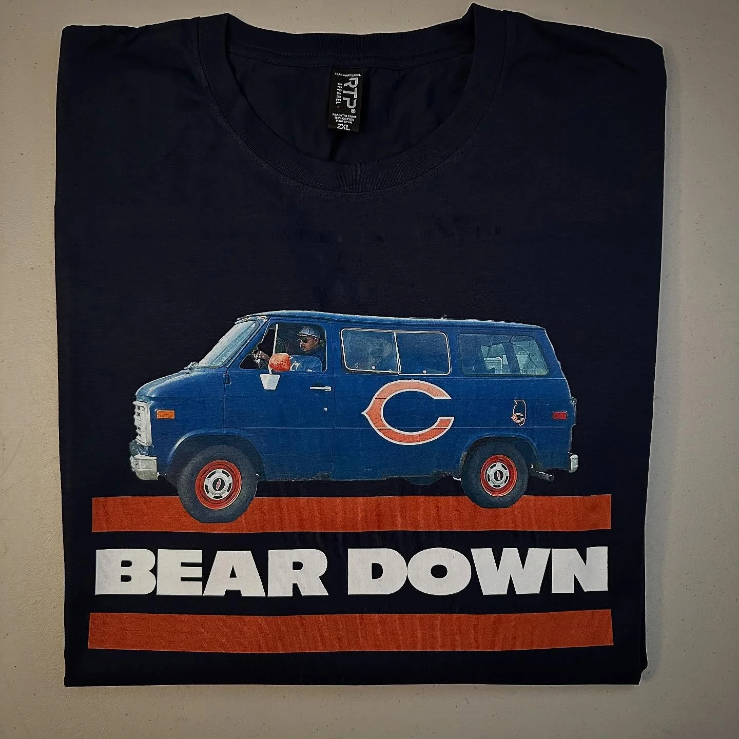 20% off sale continues 
.
Bear Down Fan Van
Navy Blue Tee
.
- Help me find these guys, so I can hook them up with shirts.
.
#bears #chicagobears #nfl #tshirt 
.
https://goaheadmerch.com/recent-additions/bear-down-fan-van