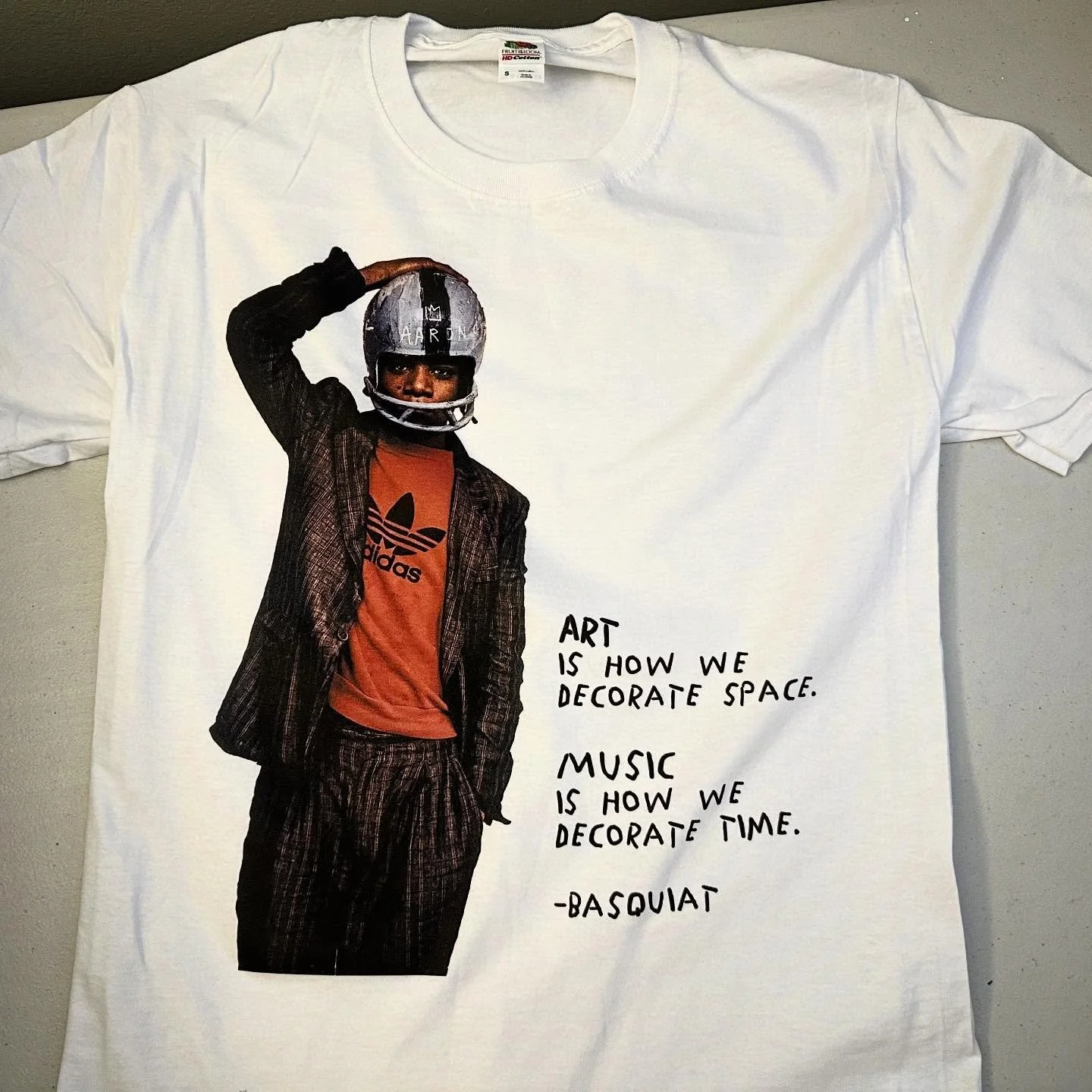 Hook .
.
Basquiat 
Short Sleeve Tee
.
&ldquo;Art is how we decorate space,
Music is how we decorate time.&rdquo;
.
https://goaheadmerch.com/lifestyle/basquiat-art-music