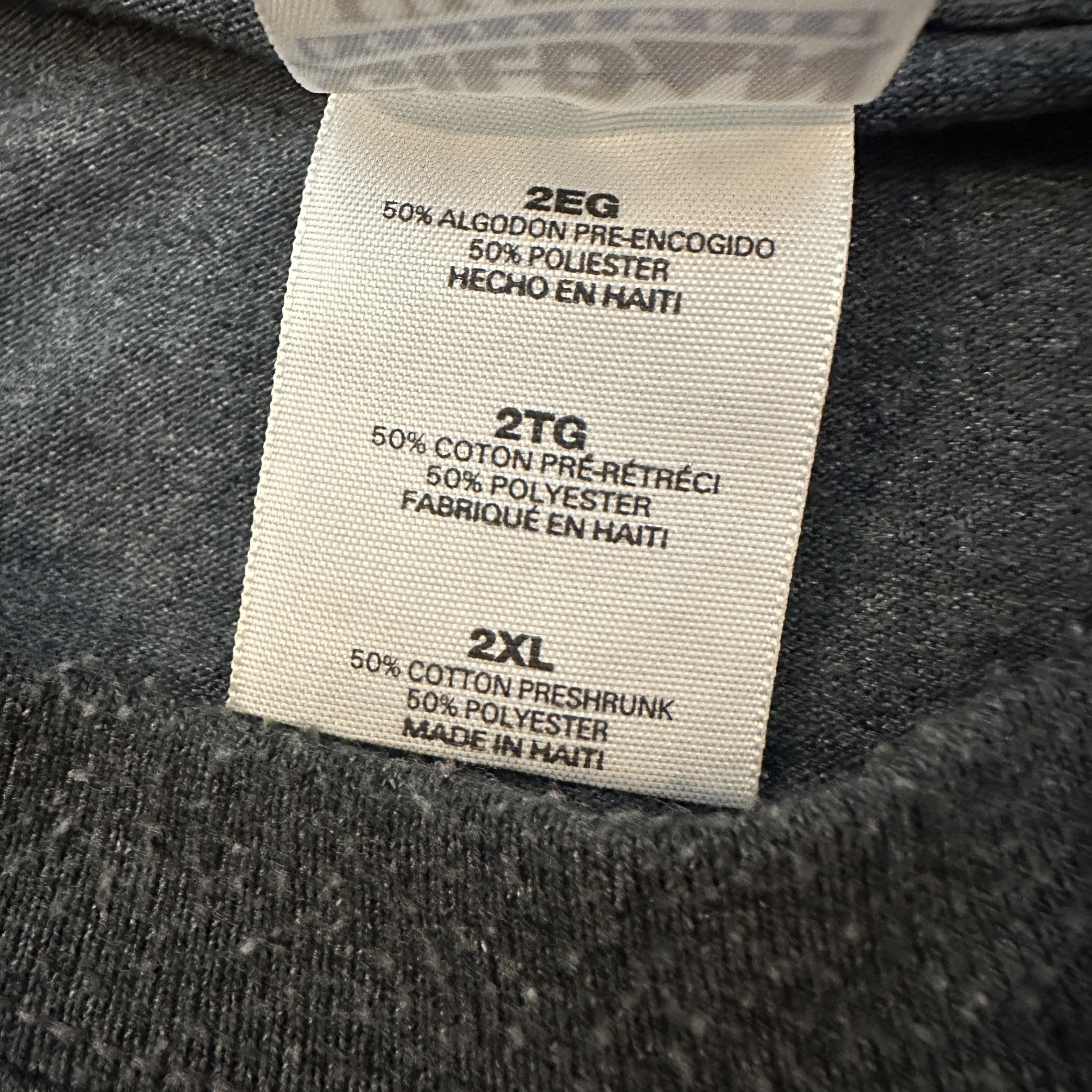 BHIC_Afro_BothSidesOfTheGun_Charcoal_TShirt_LaundryTag.jpg
