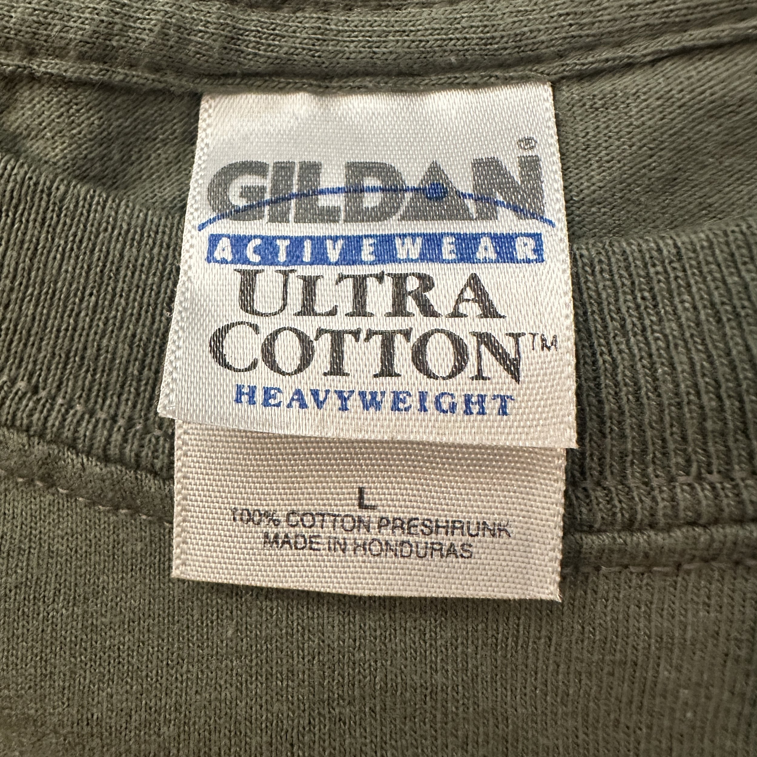 BHIC_BothSidesOfTheGun_Olive_TShirt_LaundryTag.jpg