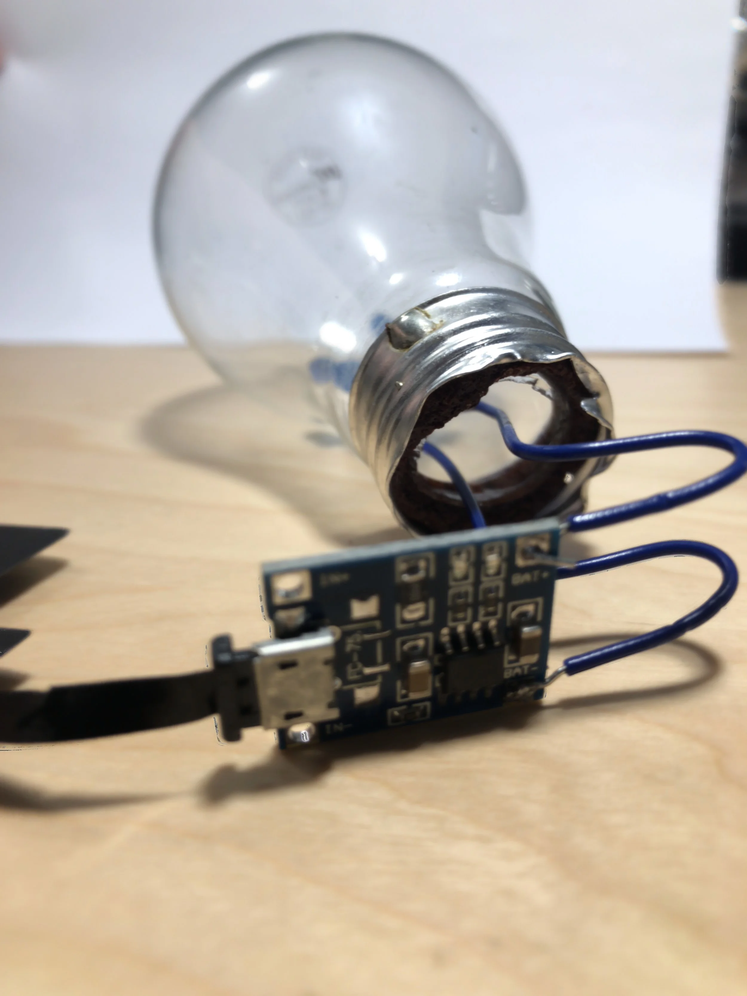 Figure 4: TP4056 charger module soldered to the LED leads.