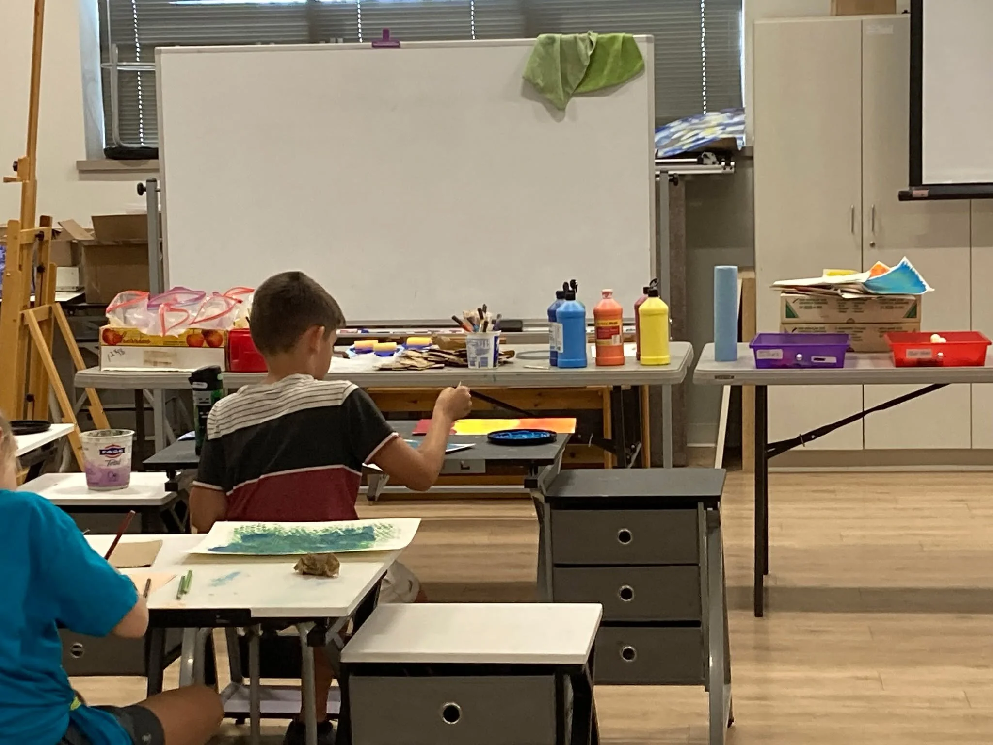 Our make-n-take kids art classes were on again for another Saturday afternoon full of ART!

This time, students created a fall collage of autumn leaves and pumpkins using paper and acrylic paints while learning about warm and cool colors, contour, an