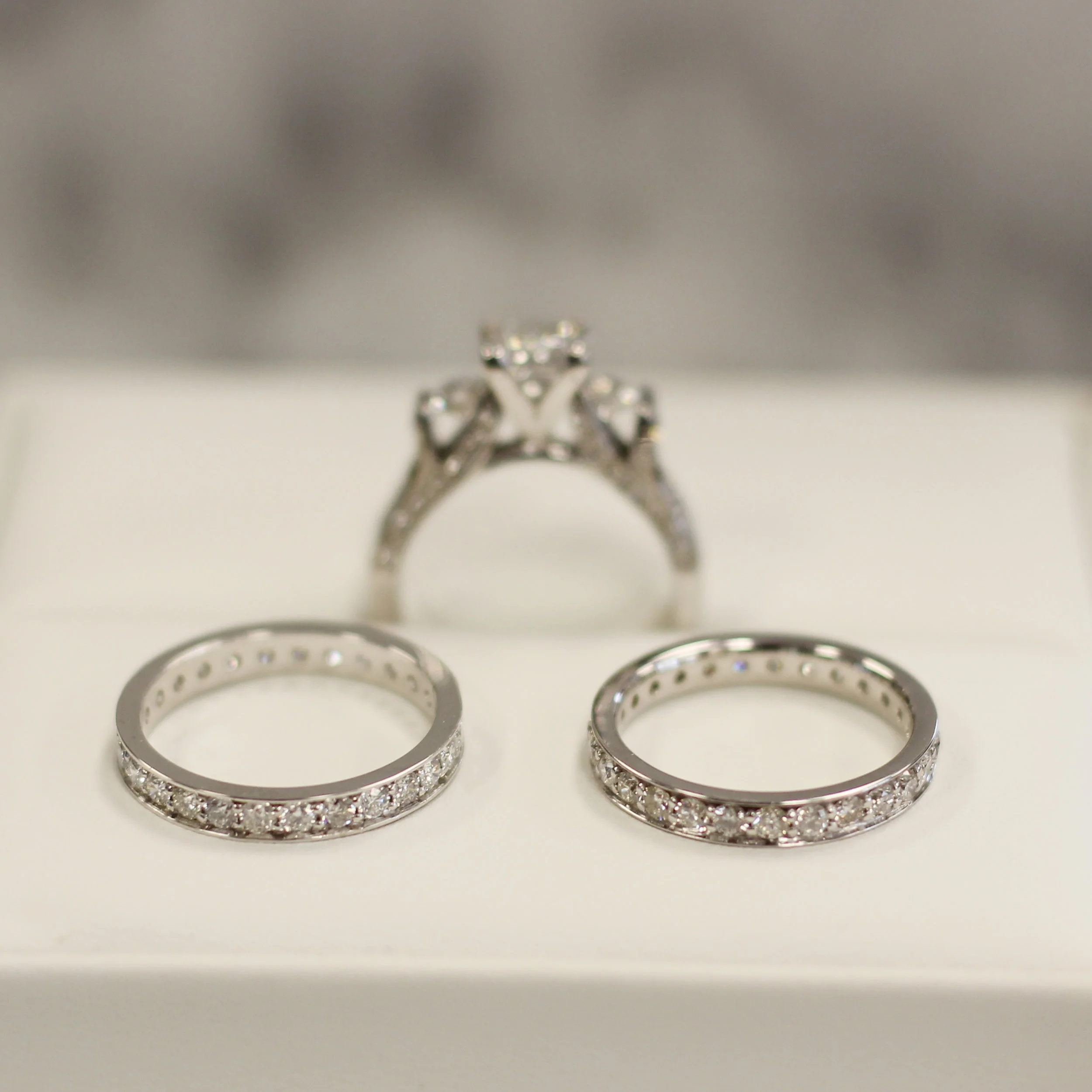 lab grown diamond three stone diamond band engagement ring with channel set eternity wedding and anniversary band