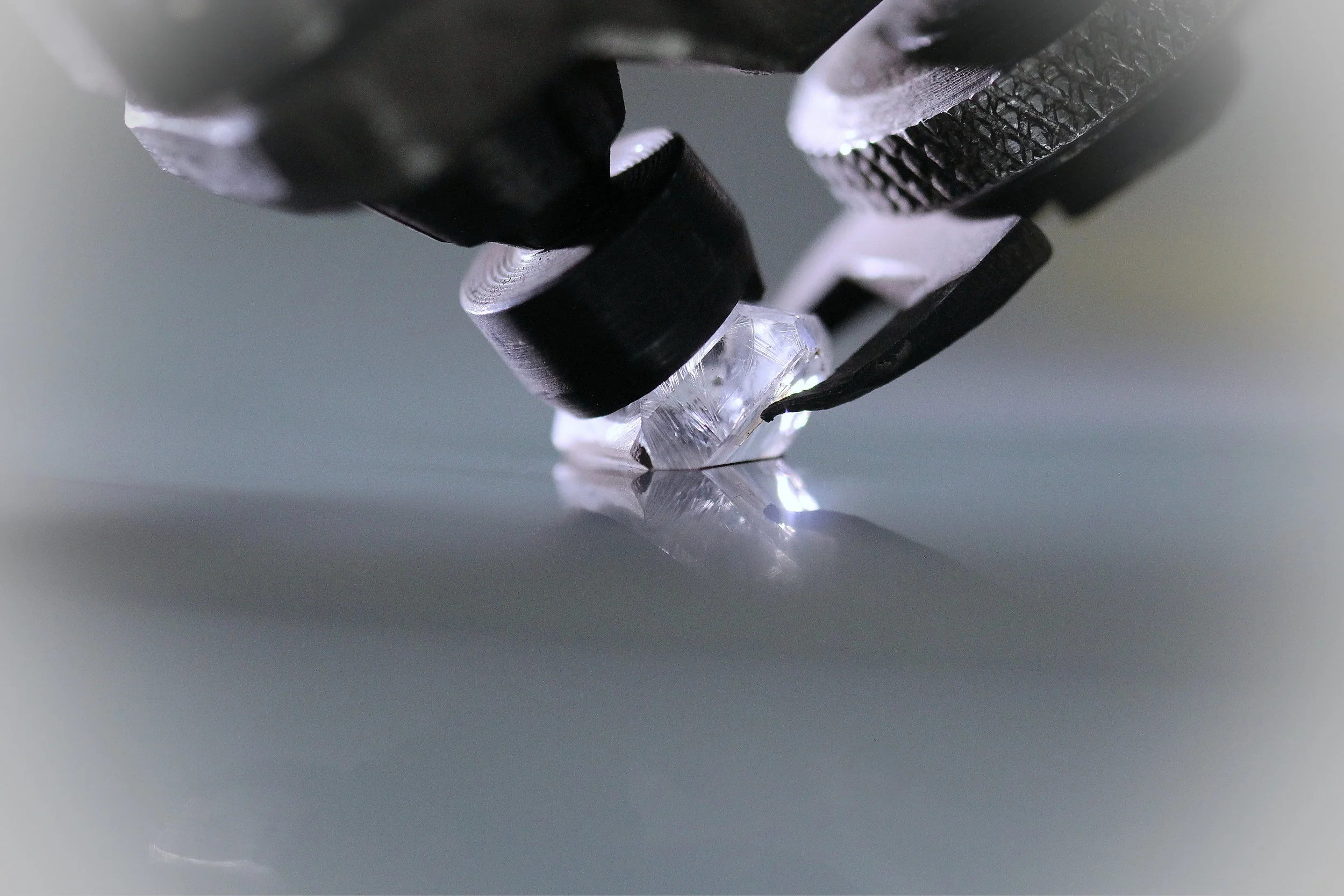 Rough Diamond being cut and polished.