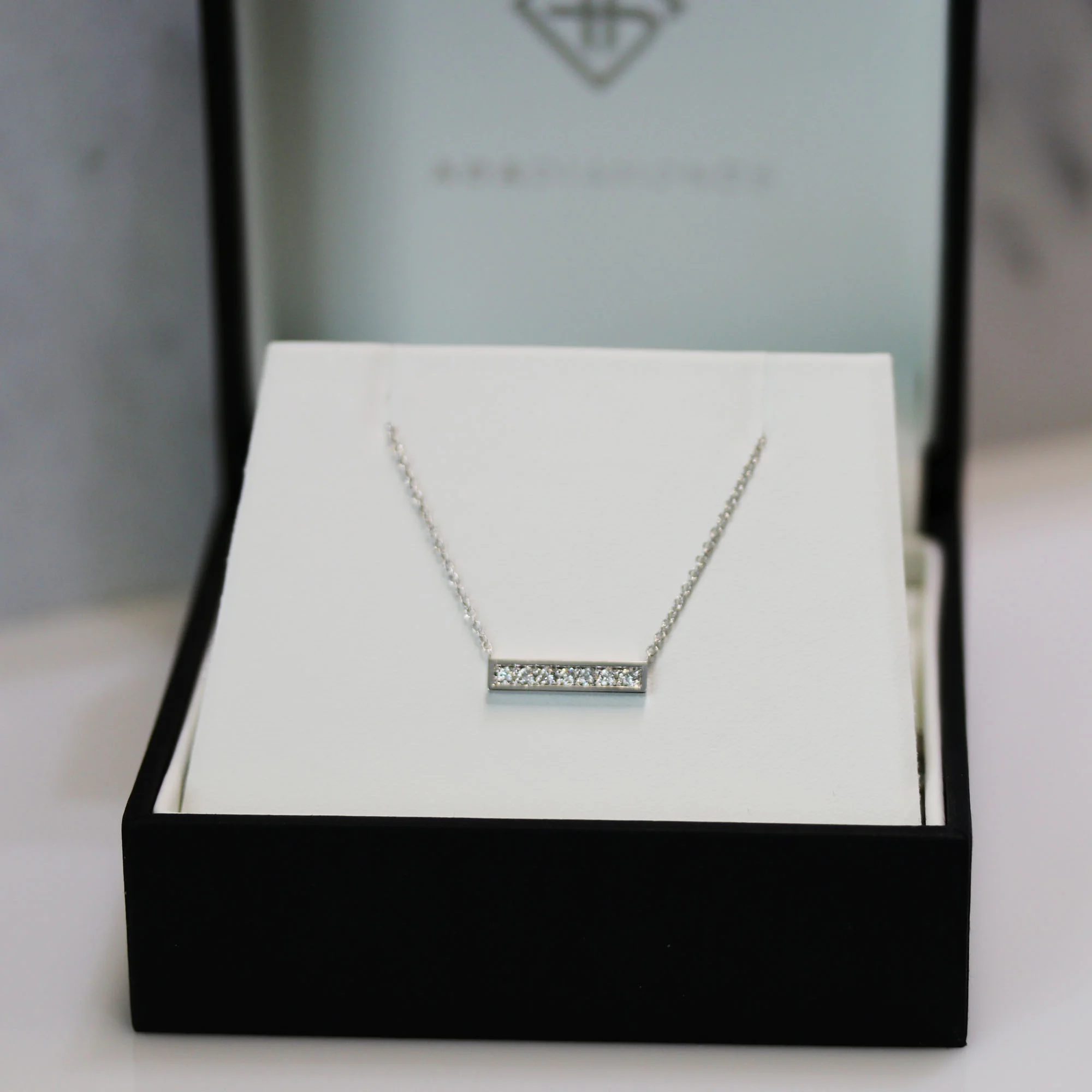 Manmade Diamond Bar Pendant In White Gold Design AD122