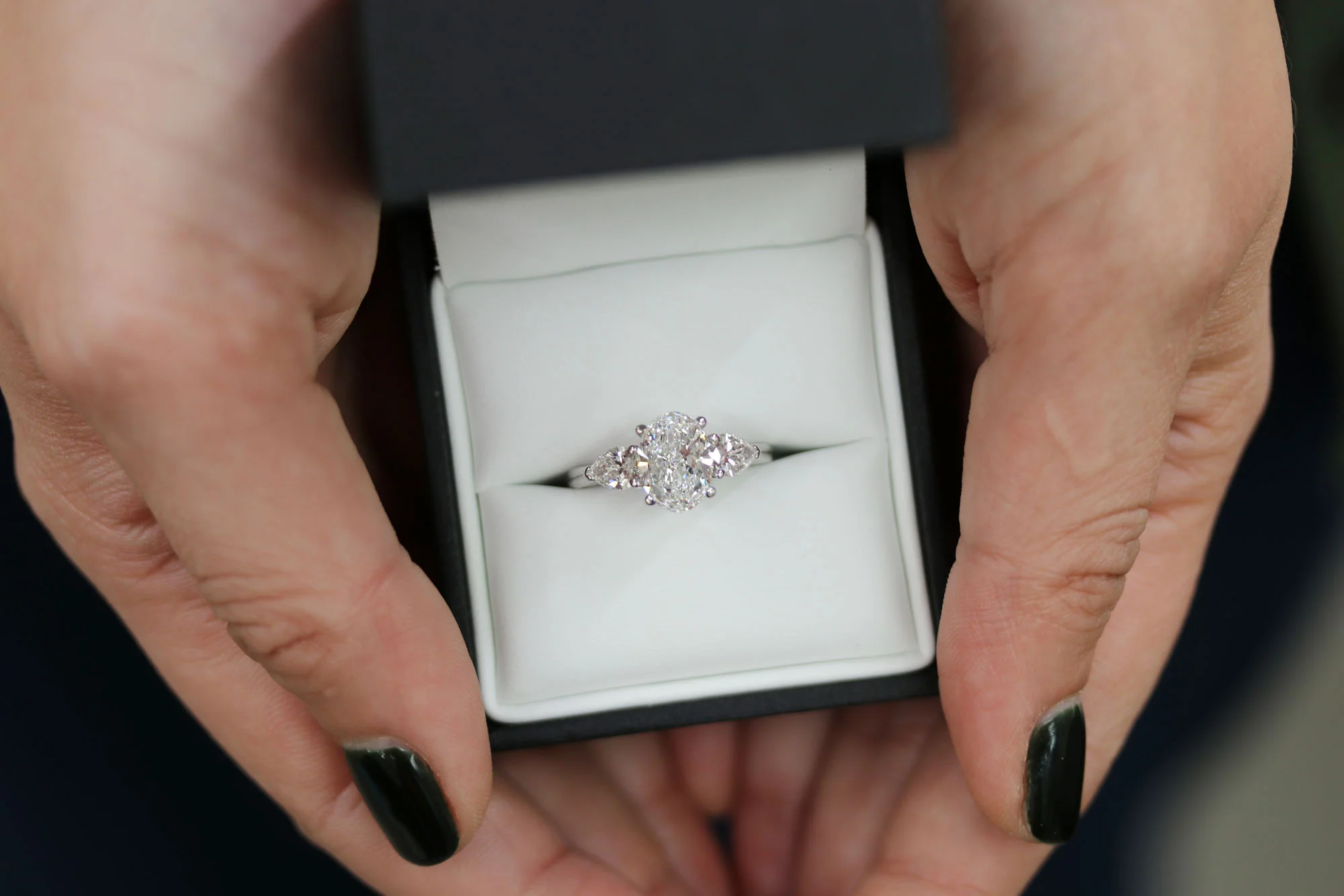 lab diamond oval and pear three stone engagement ring.jpg