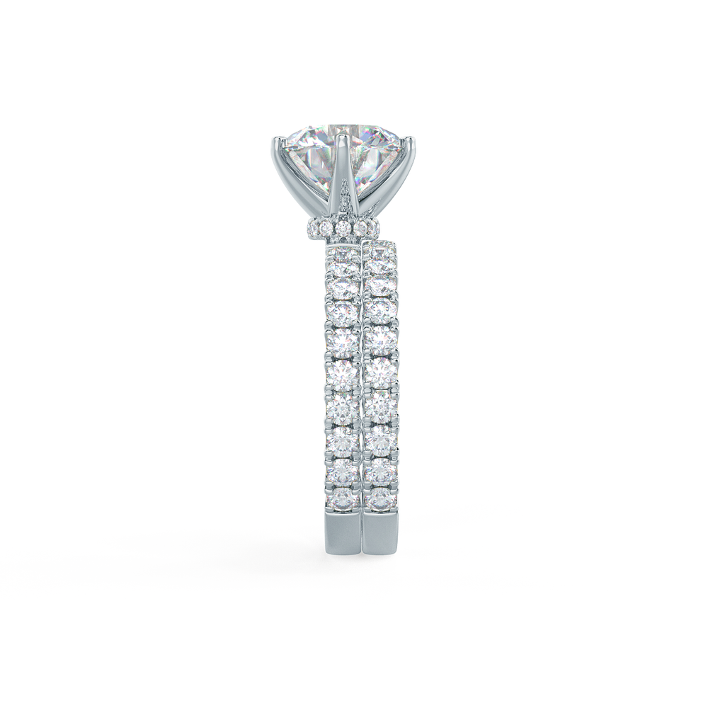This setting allows for a wedding band to sit flush with no gap. View Wedding Band Details