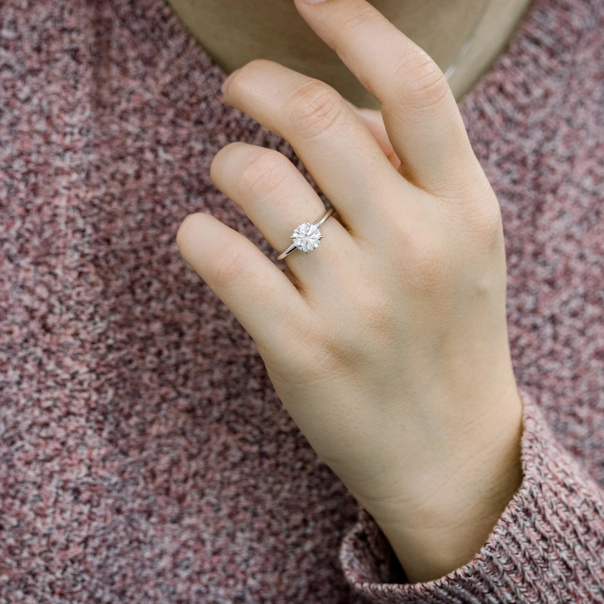 Round Solitaire Engagement Rings On Hand