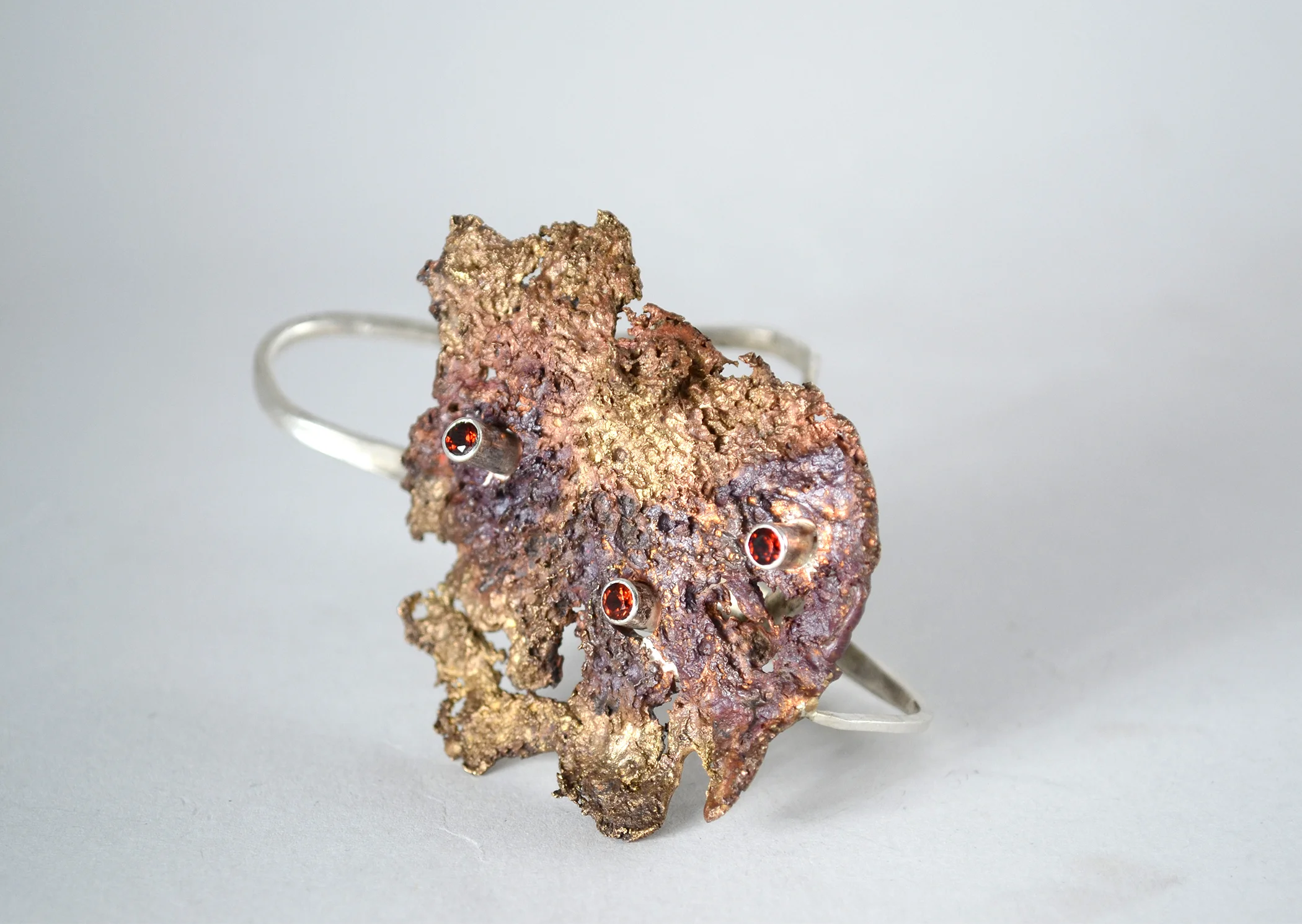 decompose | decaying mushroom cast in bronze, sterling silver, tube set garnets