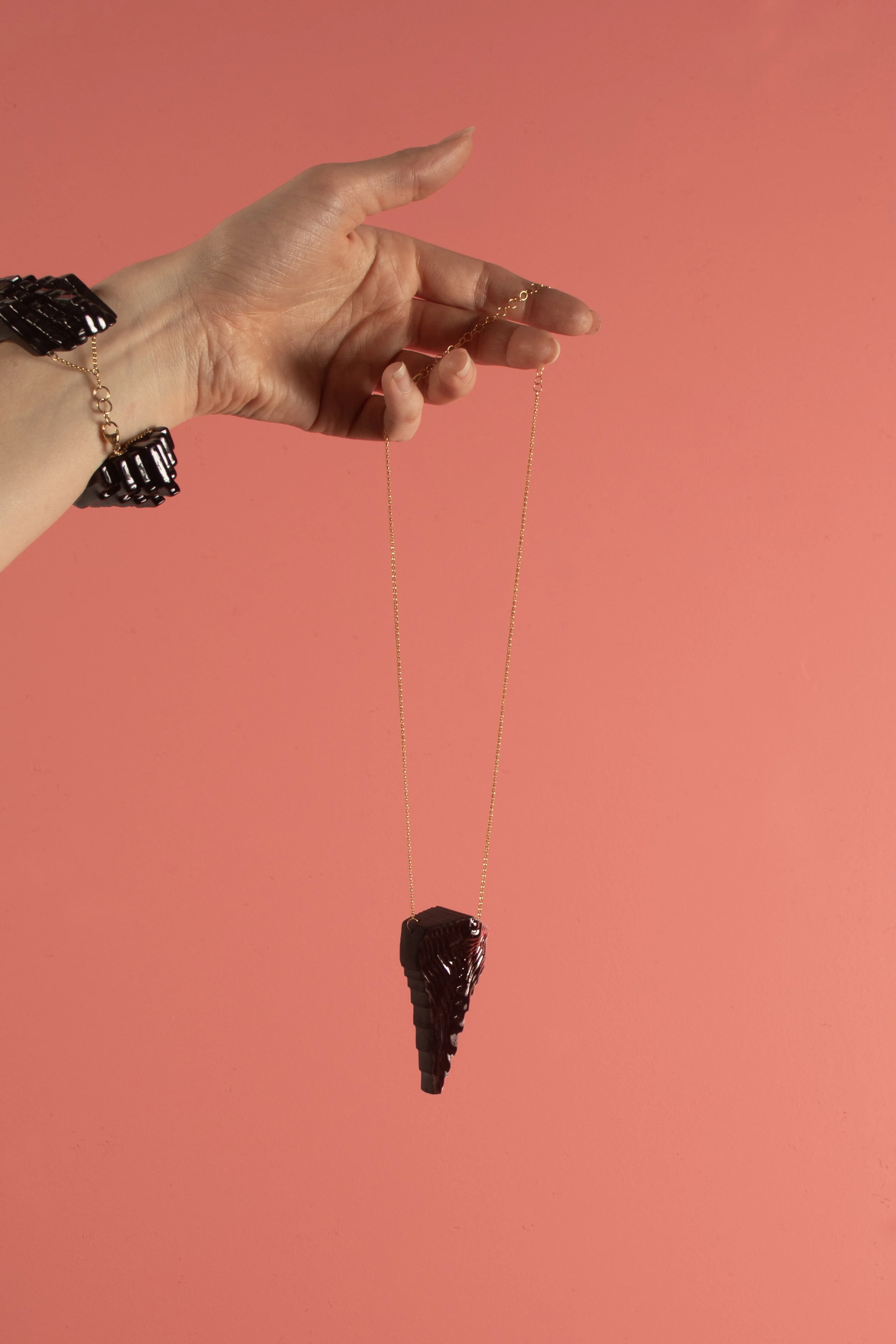 Cuffdecodaggerinblack_onpink.jpg
