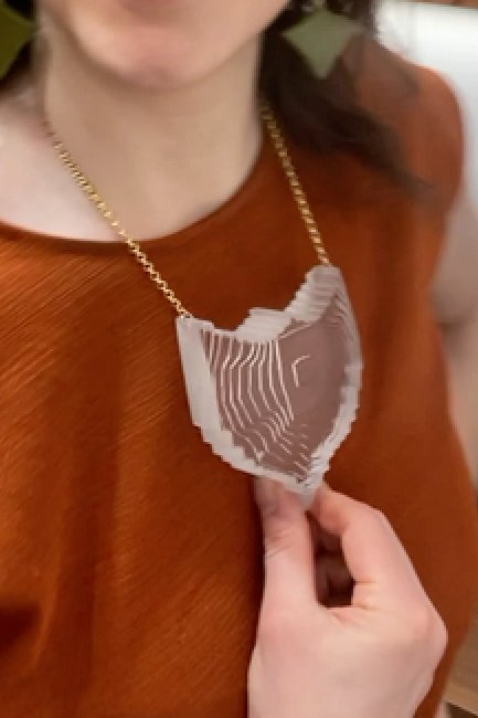 PendantTextureShieldinClear_close_onbody.jpg