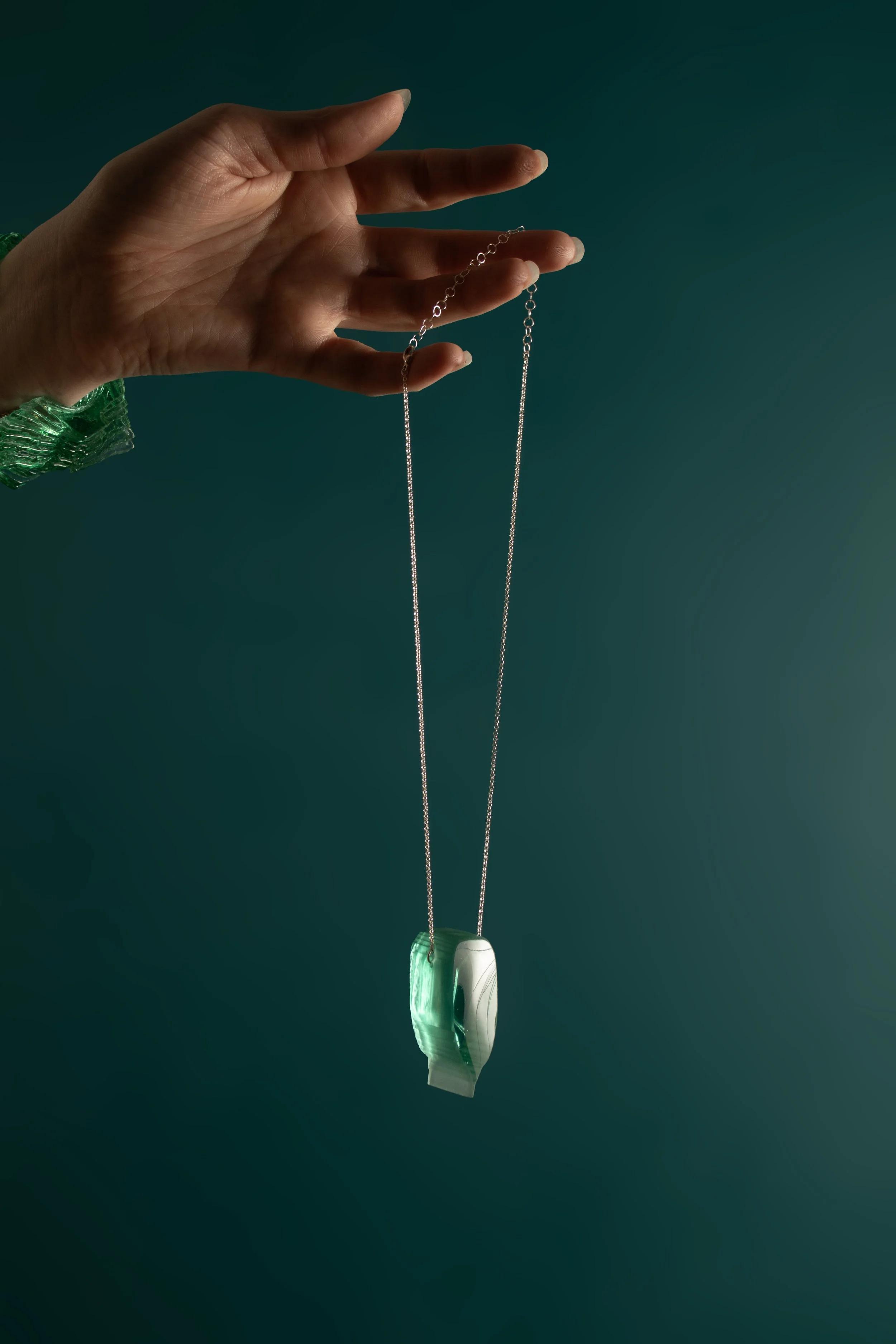 ElongatedRoundedShieldinJade_onteal.jpg