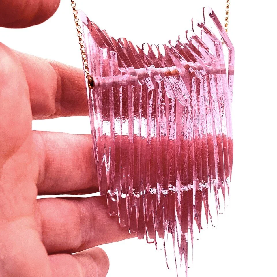 Celebrating Kinetic Shield Necklaces from every angle