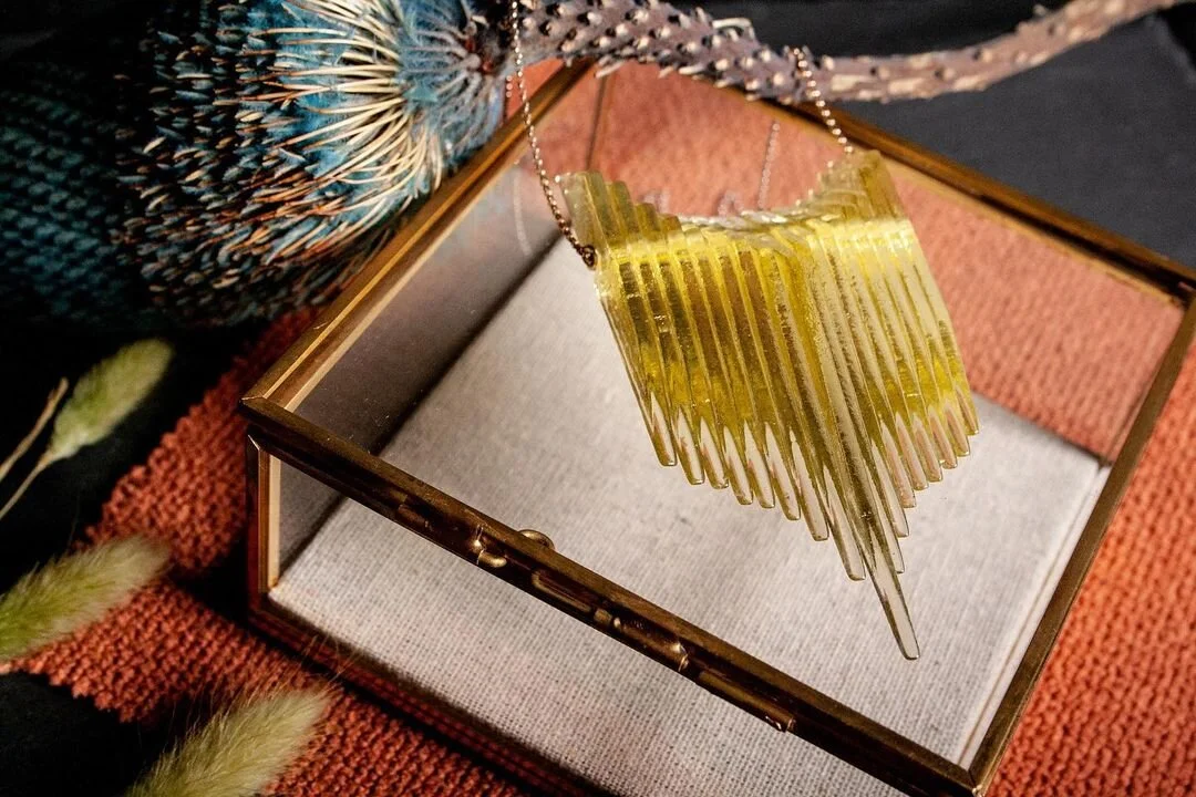 Our Kinetic Shield Necklace in Green Tea Tint