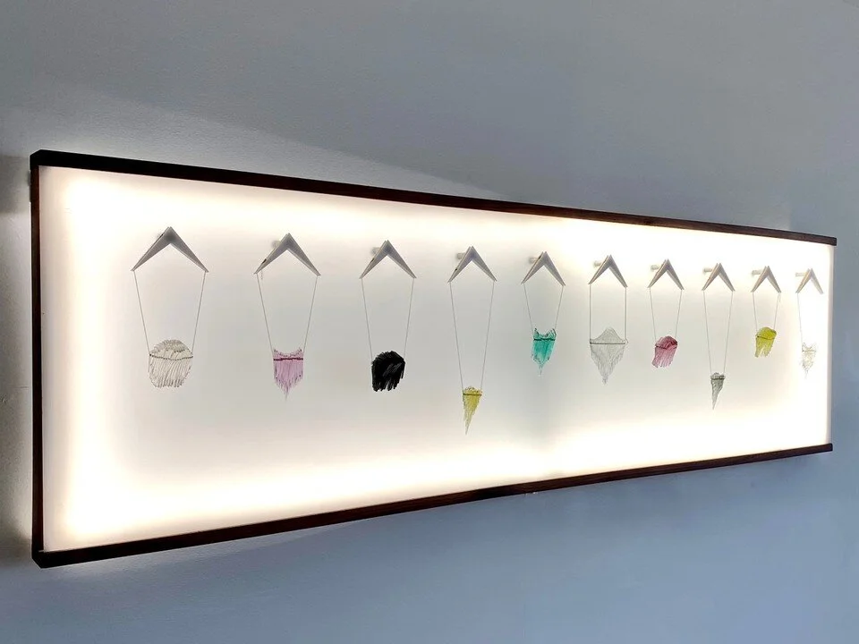 A sneak peek of our showroom featuring kinetic necklaces!