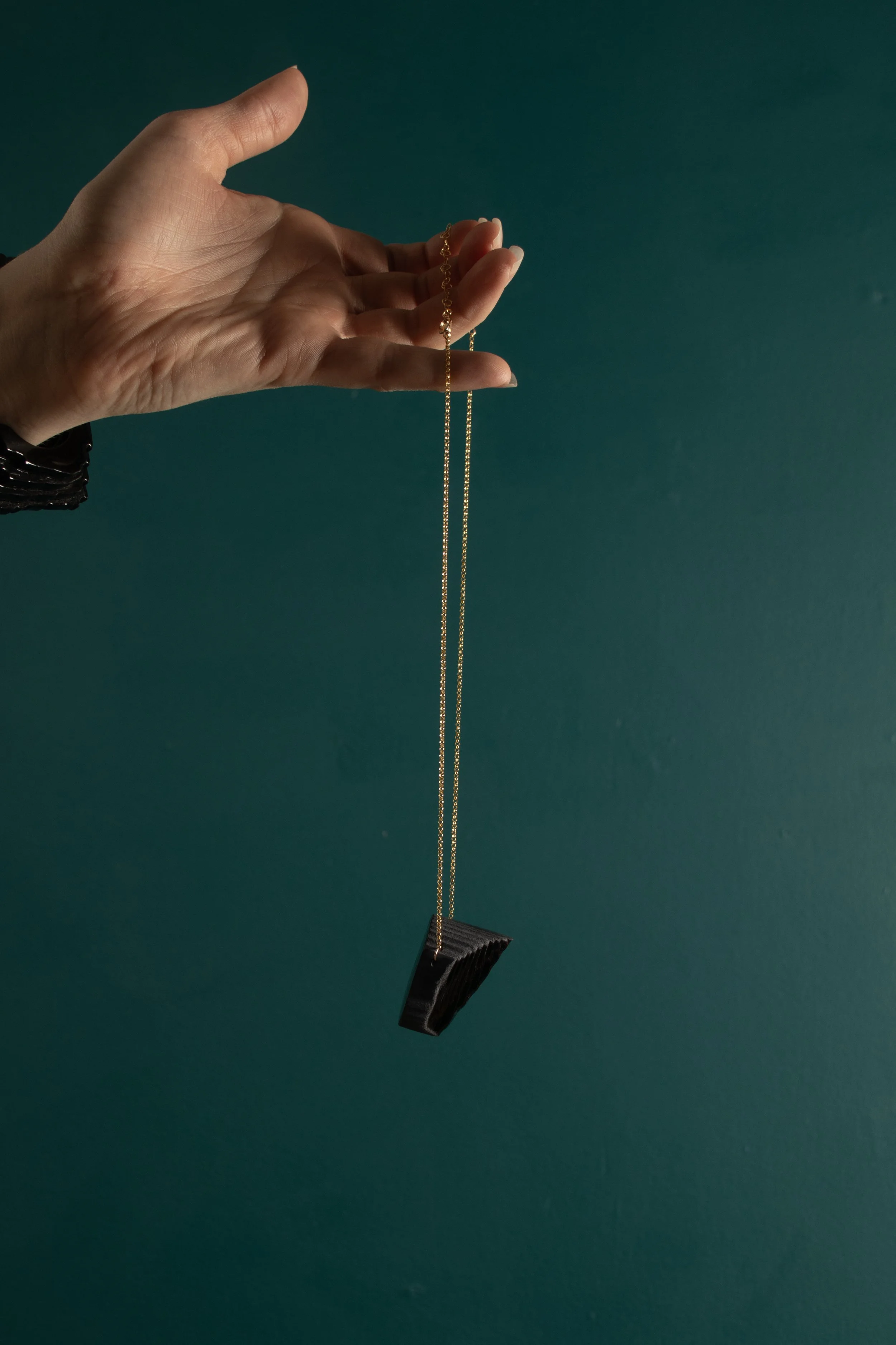 PendantTextureMiniEllipseinBlack_profile_onteal.jpg
