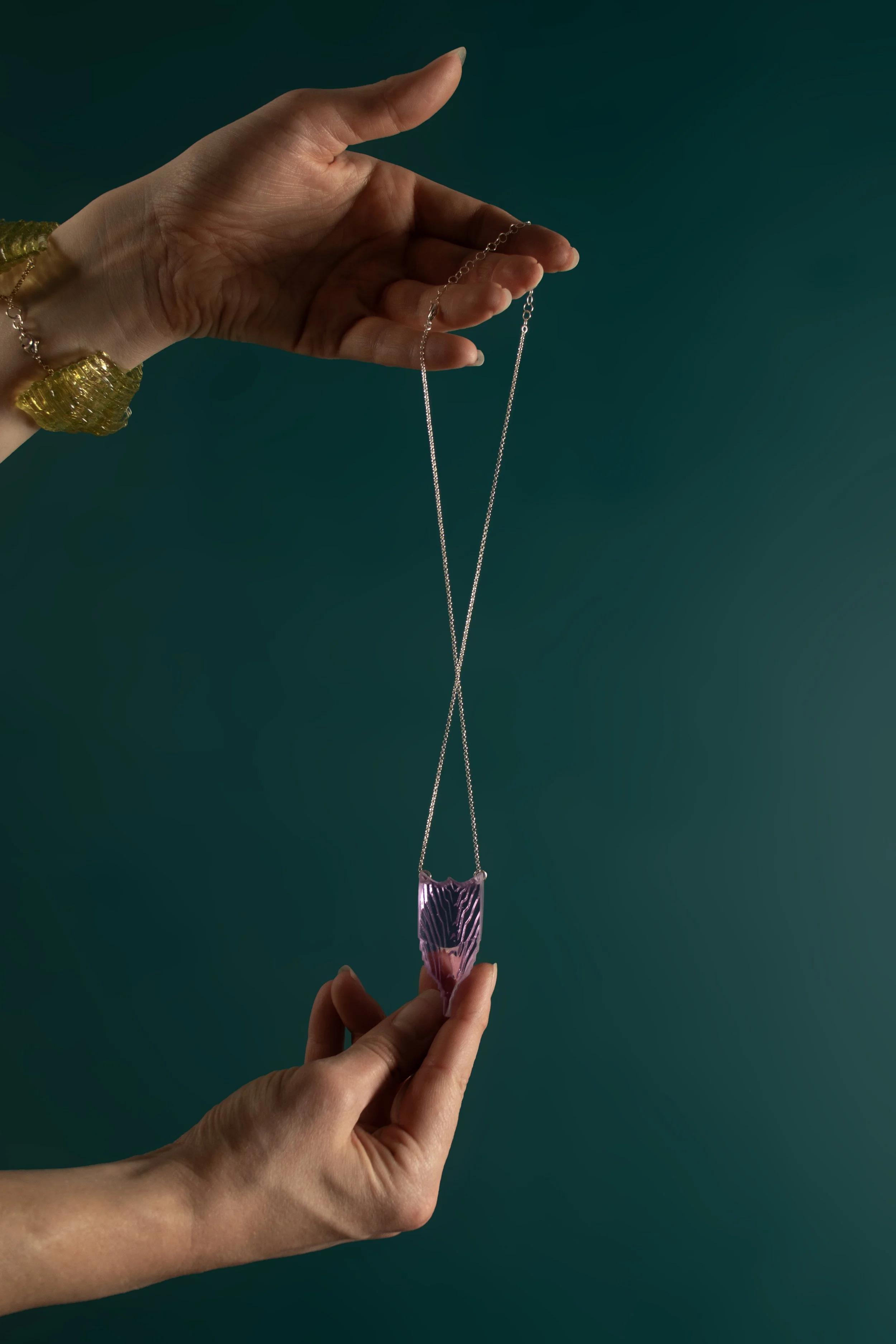 CuffElongatedShieldinFuchsia_back_onteal.jpg