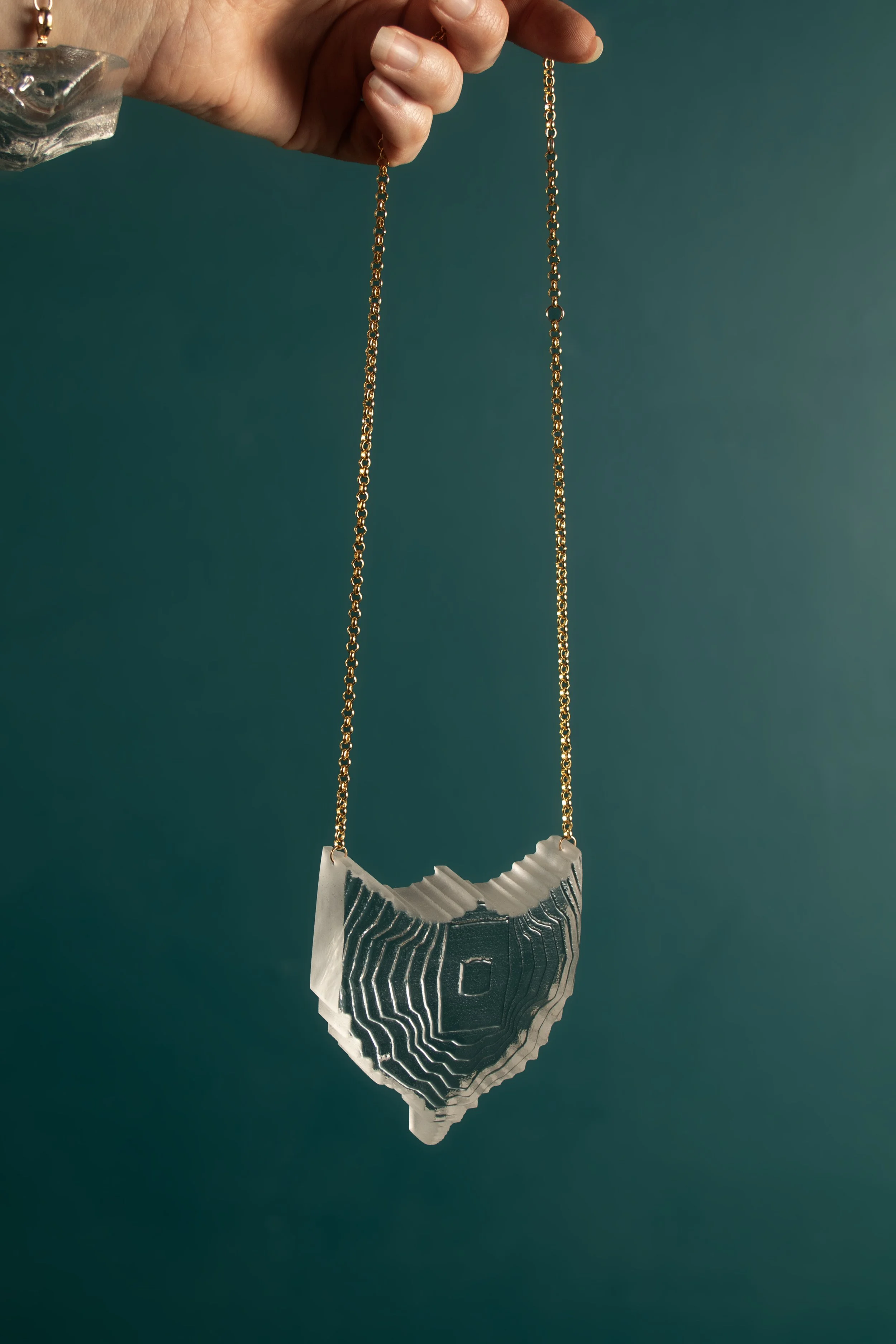 PendantTextureShieldinClear_onteal copy.jpg