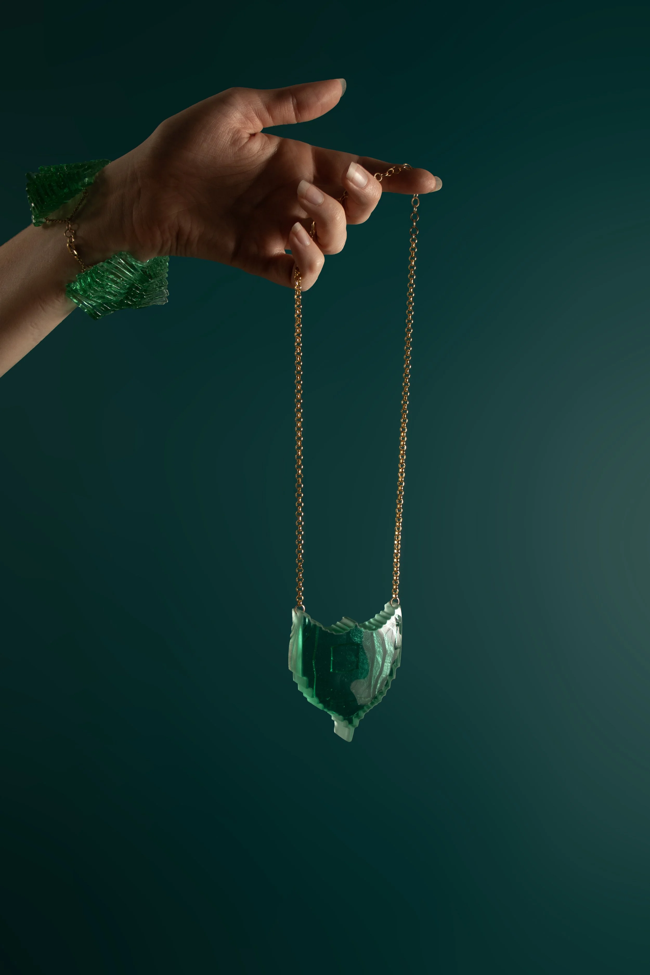 JadeShield_facingright_onteal.jpg