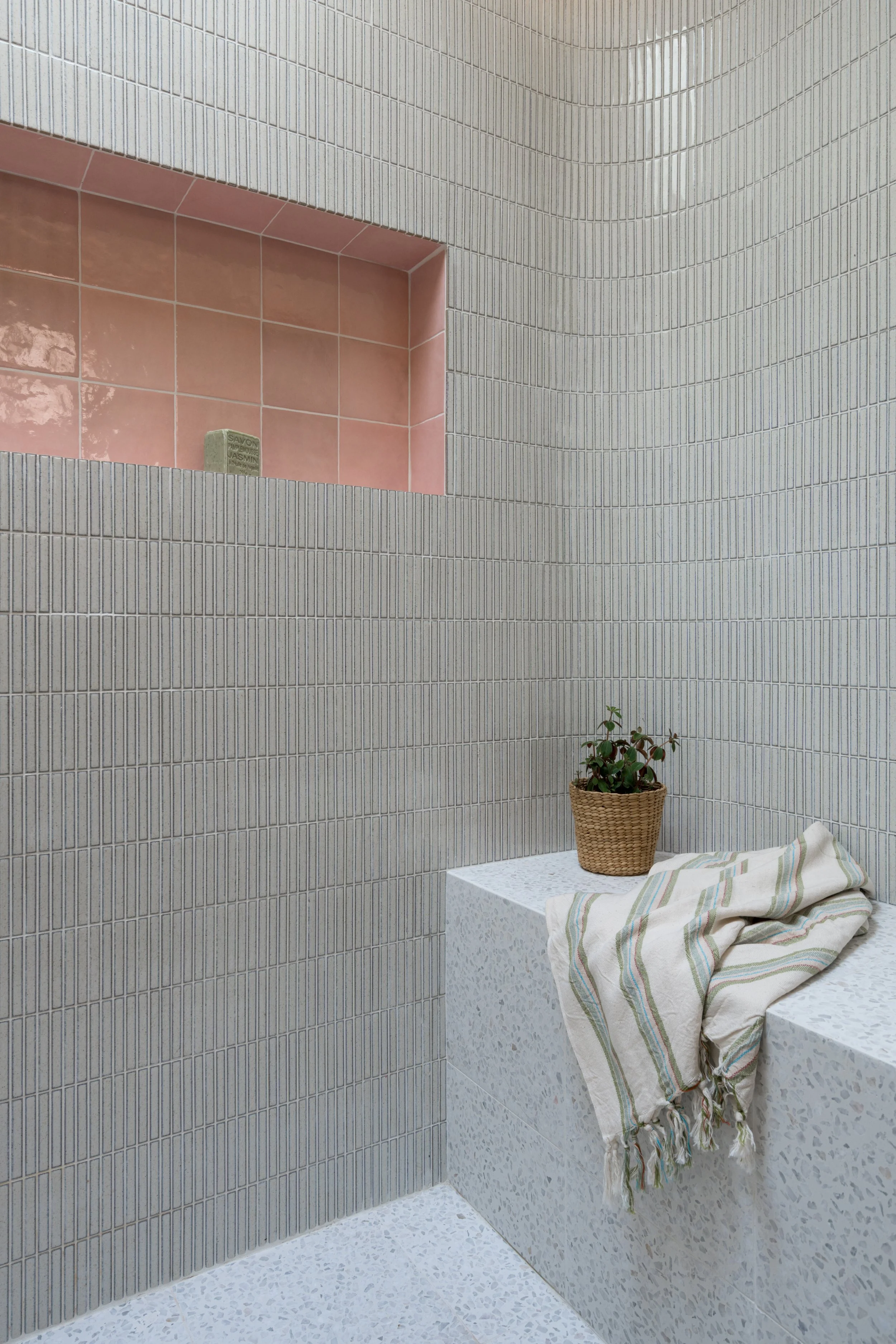 curved shower, terrazzo tile, kit kat tile