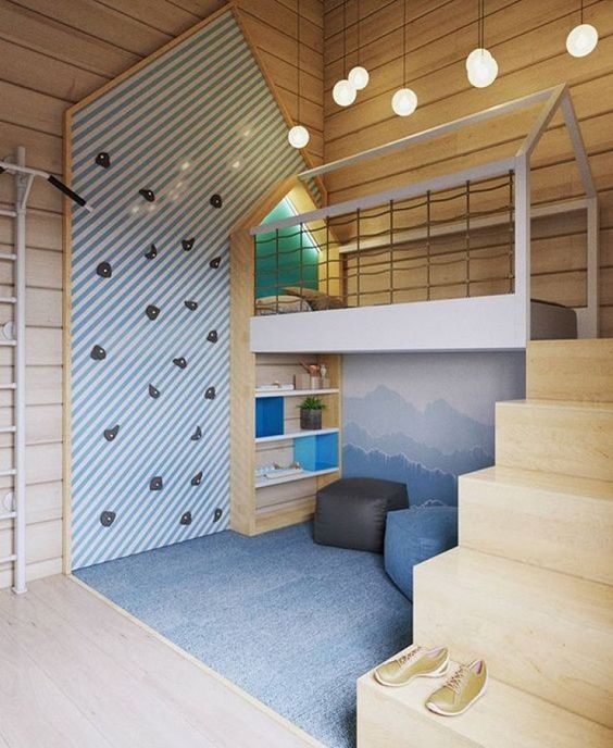 This room was designed by Russian Interior designer Ekaterina Domracheva . It makes me question what kid wouldn't want a climbing wall in their bed room?