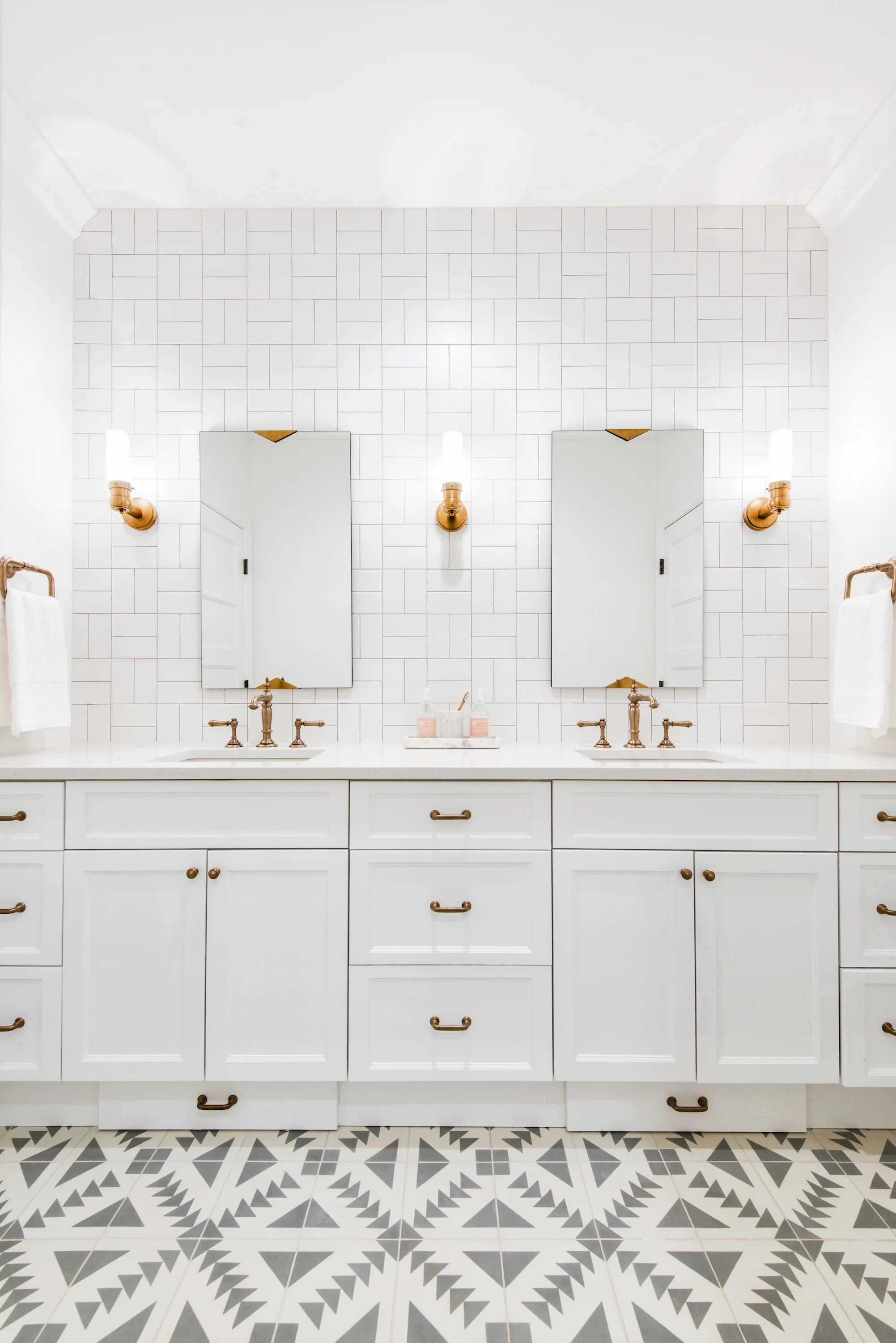 Caitlin Wilson used the cross hatch method in her bathroom, paired with aztec tile for a fresh look!