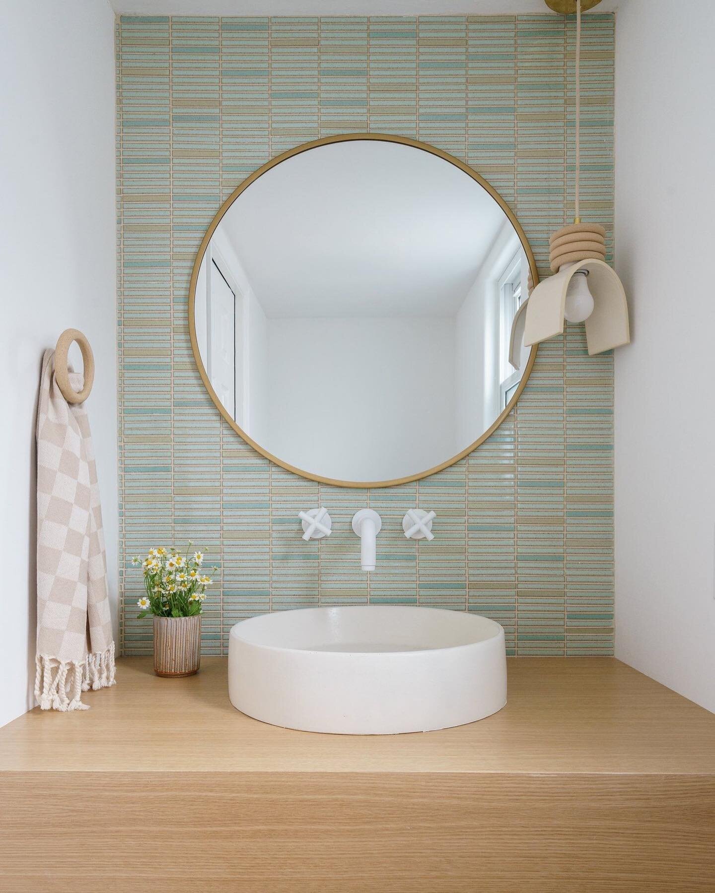 A matte white faucet, some mint green Kit Kat tile, and a ceramic pendant light give this small space some added character! 
📸 by @charlotteleaphotography 
Design by Popix Designs