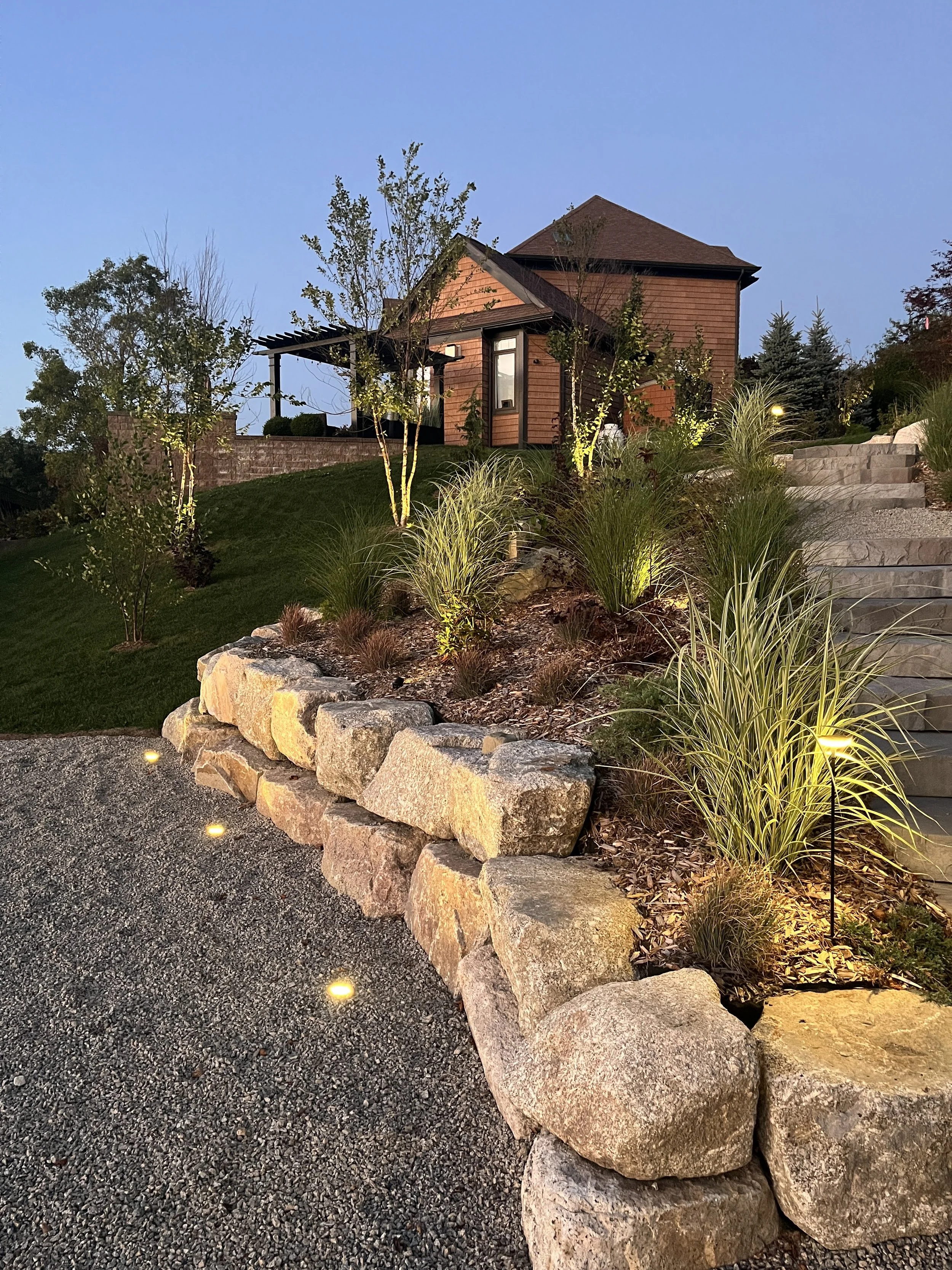 For this Lake Charles landscape, the lighting casts subtle highlights on the structures and plants just as the sun starts to set.