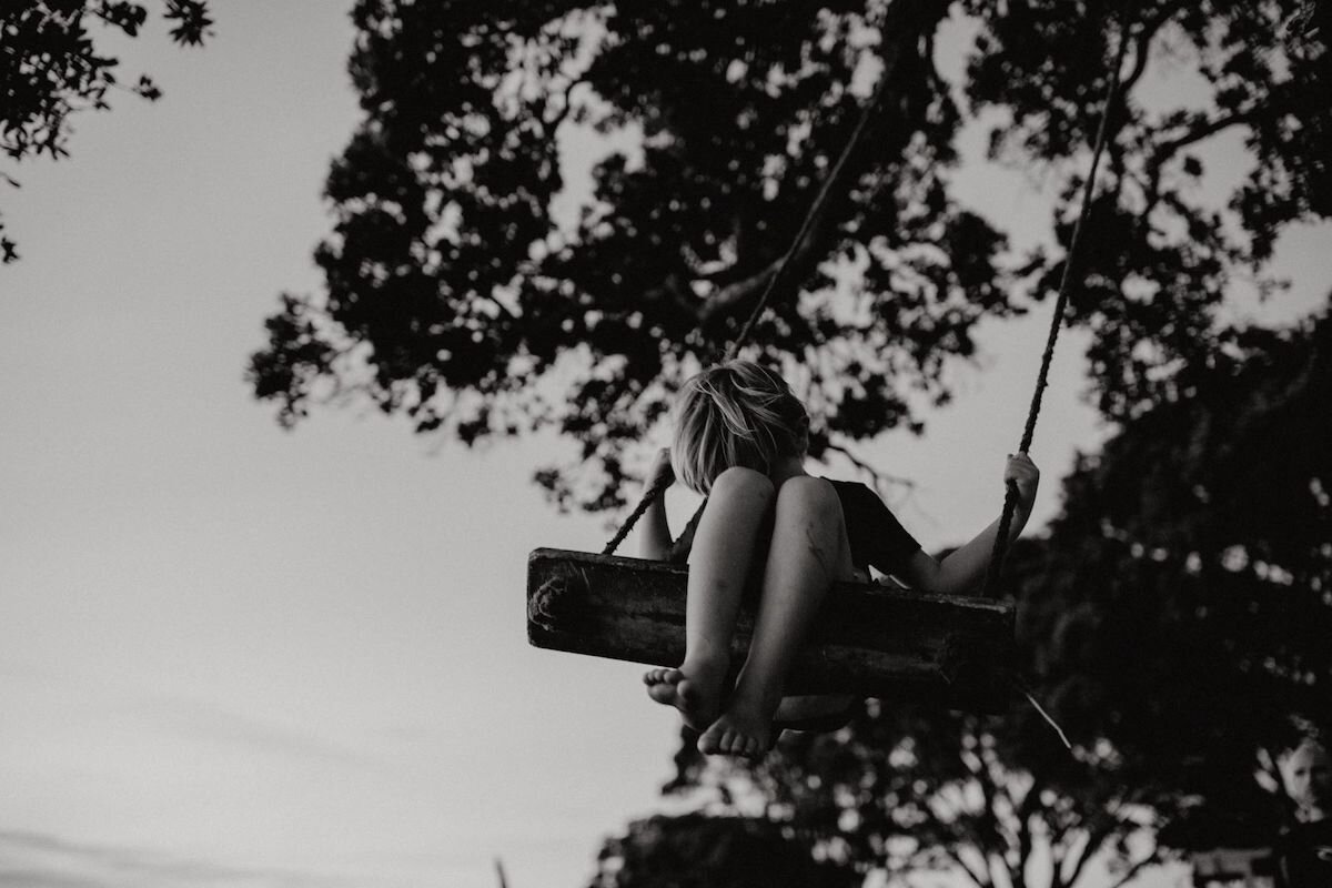 Photograph of boy on swing - Emily Chalk.jpg