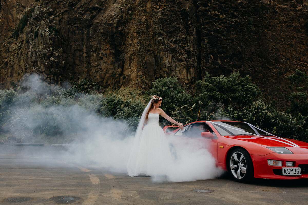 Emily Chalk Photographer - Car, bride and groom on beach.jpg