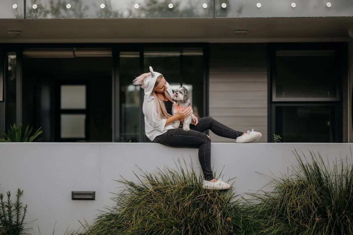 I love animals and always include them in photos where I can. The gorgeous Katie is an early childhood teacher and a friend. She’s a fun unicorn, princess and Disney-loving chick, so I told her to embrace that and she wore a unicorn cape and dressed her dog in a tutu, which I love! Katie was alone during lockdown and photographing her on the back wall of her apartment was a fun way to break up her day.