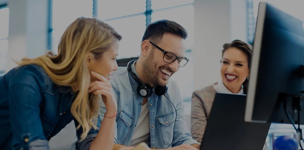 Happy-coworkers-at-computer.jpg
