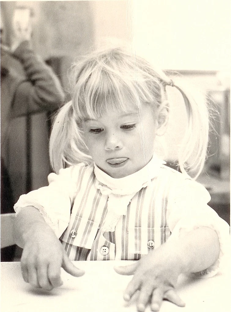Me as a busy pre-schooler, creating a masterpiece. (You can tell I'm concentrating because my tongue is sticking out.)