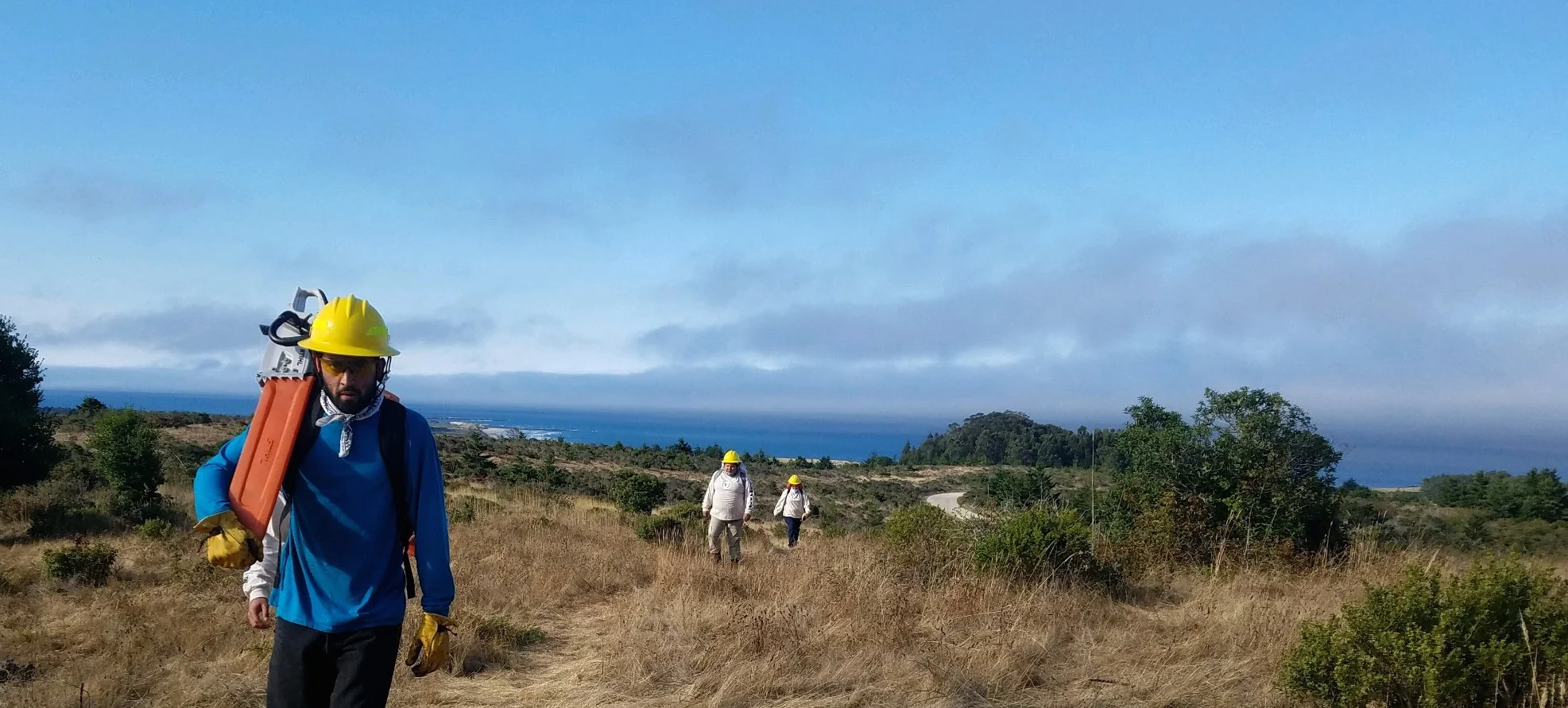 AMLT Native Stewards EJ Arias, Serenity Luna, and Marcella Luna approaching the work site. Photo courtesy Jeanette Acosta.