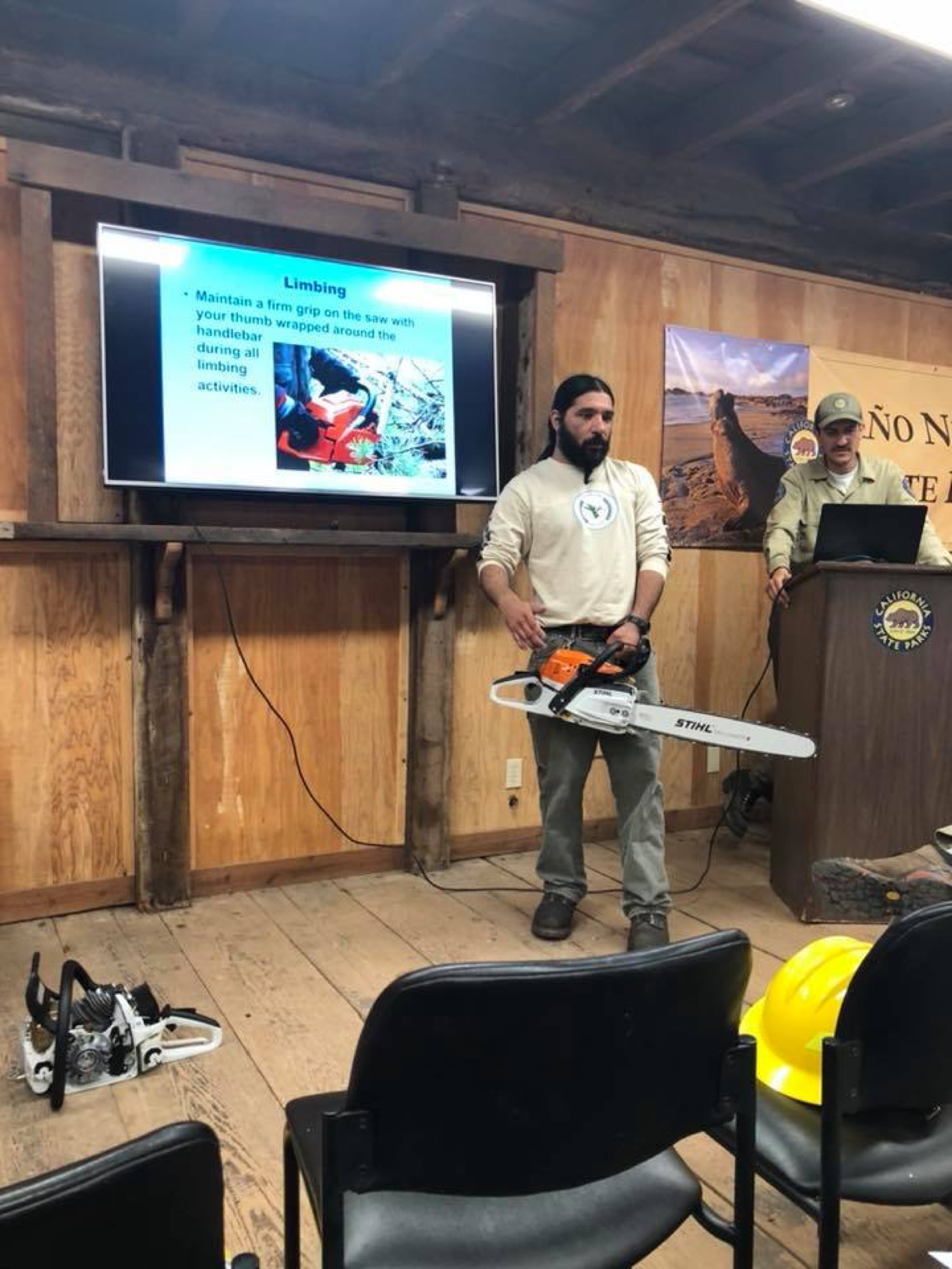 NSC Deputy Director Abran Lopez, an experienced sawyer, trains “green” crew members along with California State Parks field staff. Photo courtesy Mariah Cuevas.