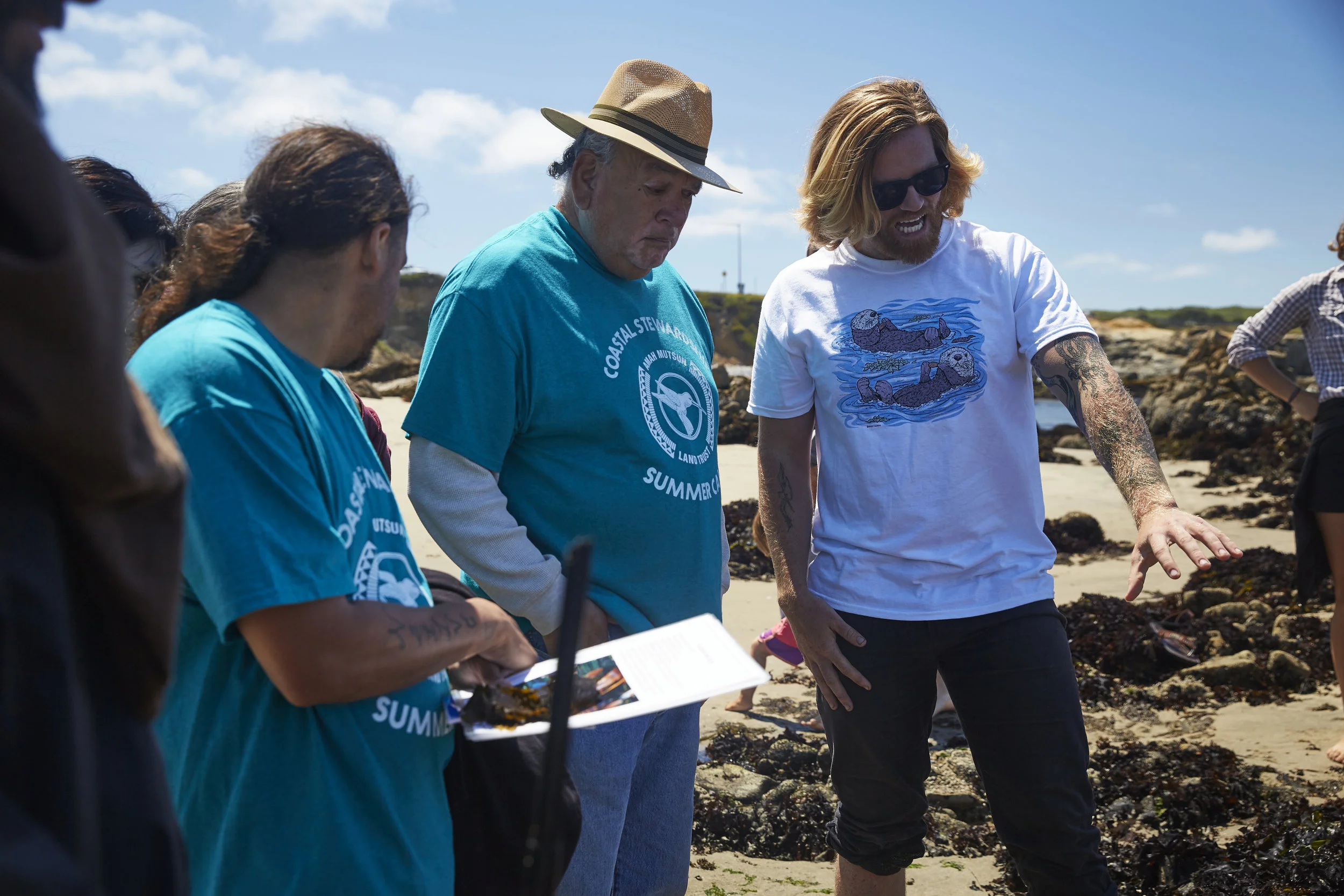 Gabriel Pineida, Val Lopez, and Mike Grone (Left to right) looking at mussel beds. Photo courtesy of Rob Brodman