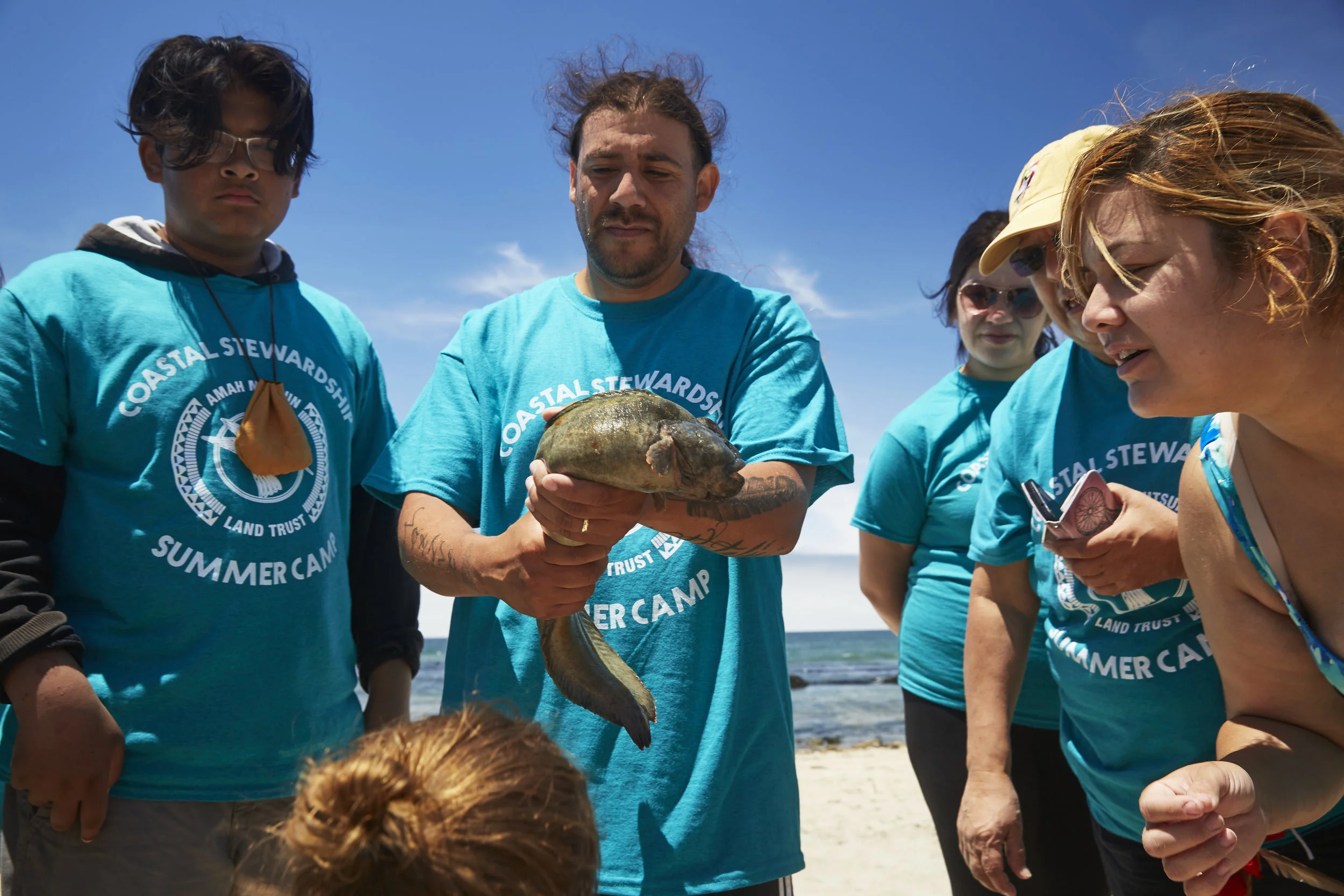 Native Steward Gabriel Pineida holding monkeyface prickleback fish!