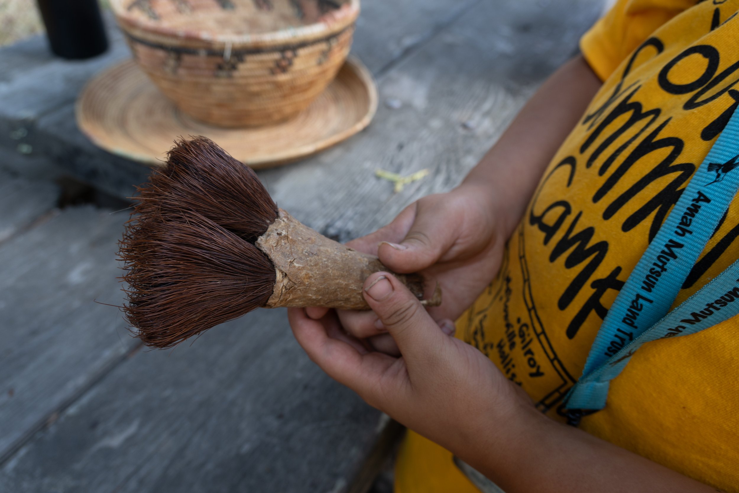 Holding a native soap root made into a brush