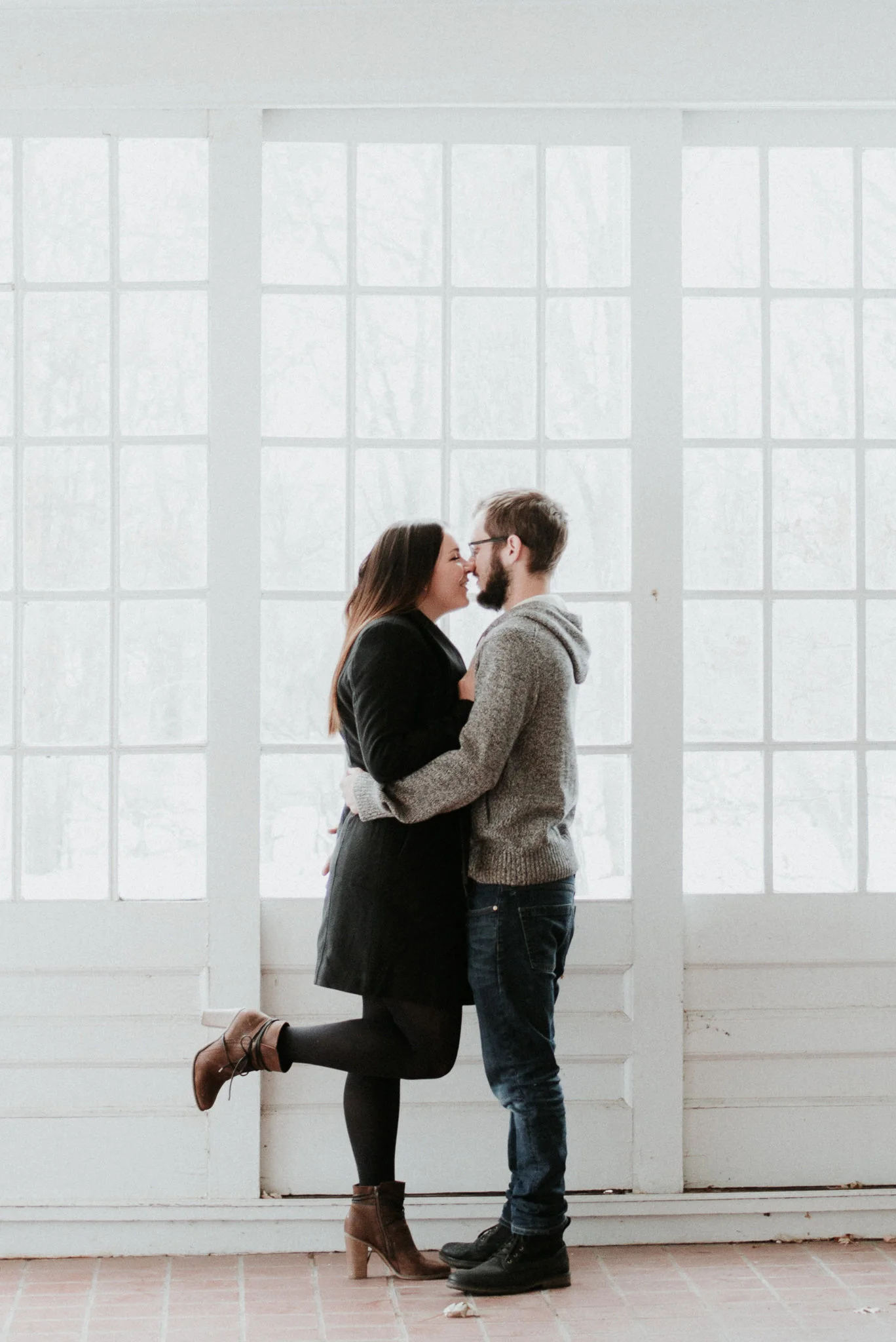 engaged couple kissing