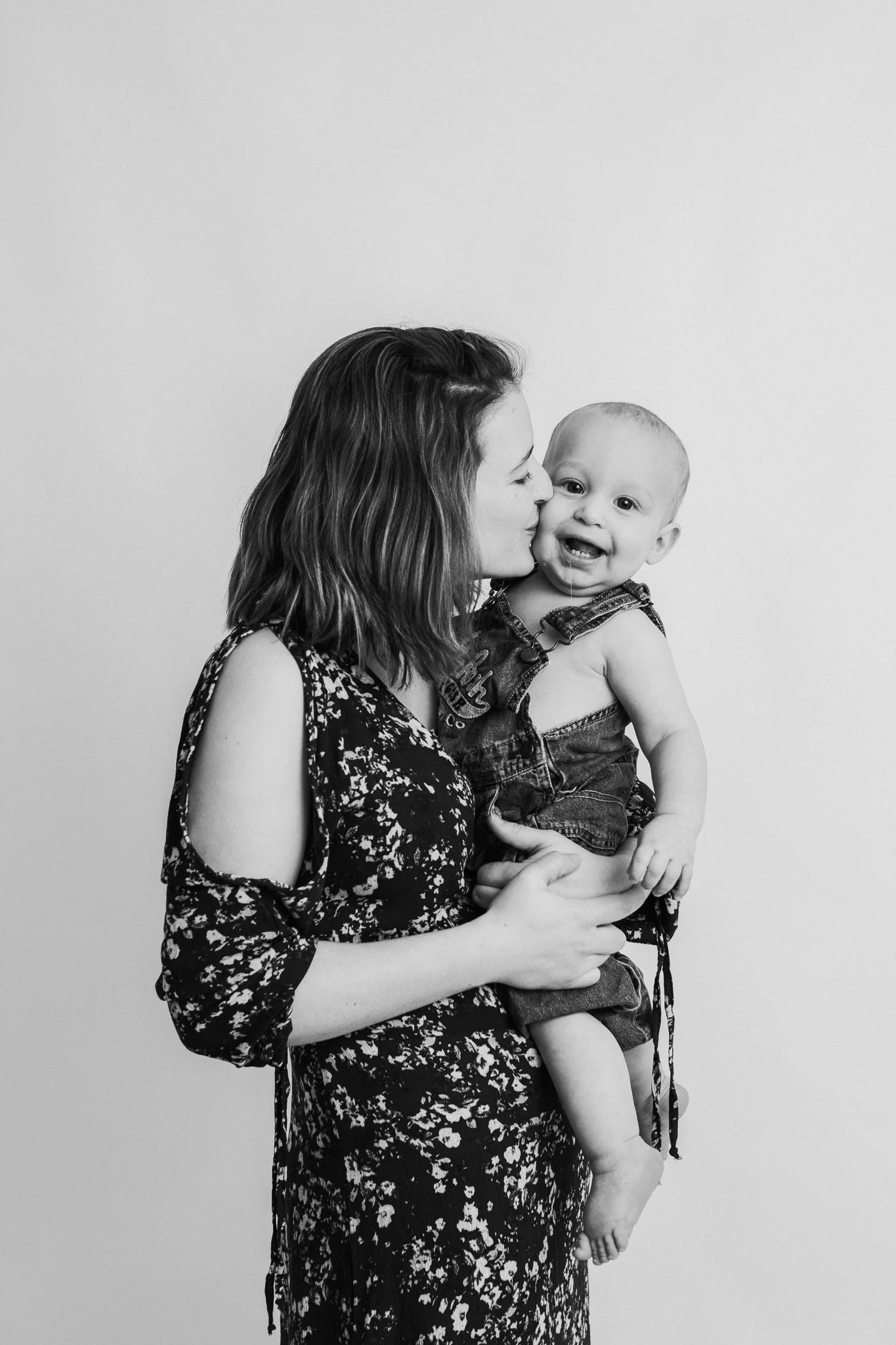 mom kissing little boy