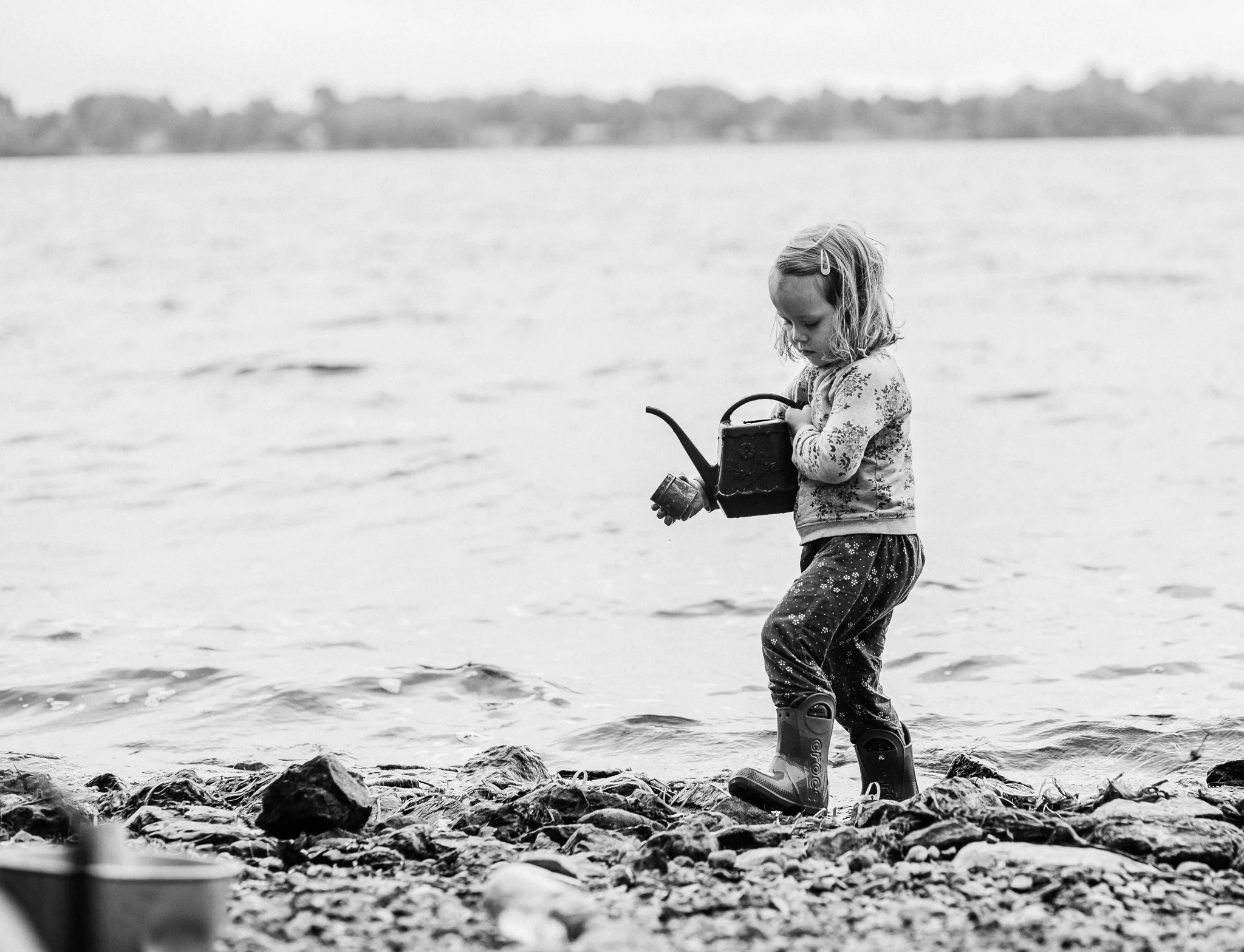 girl playing by water